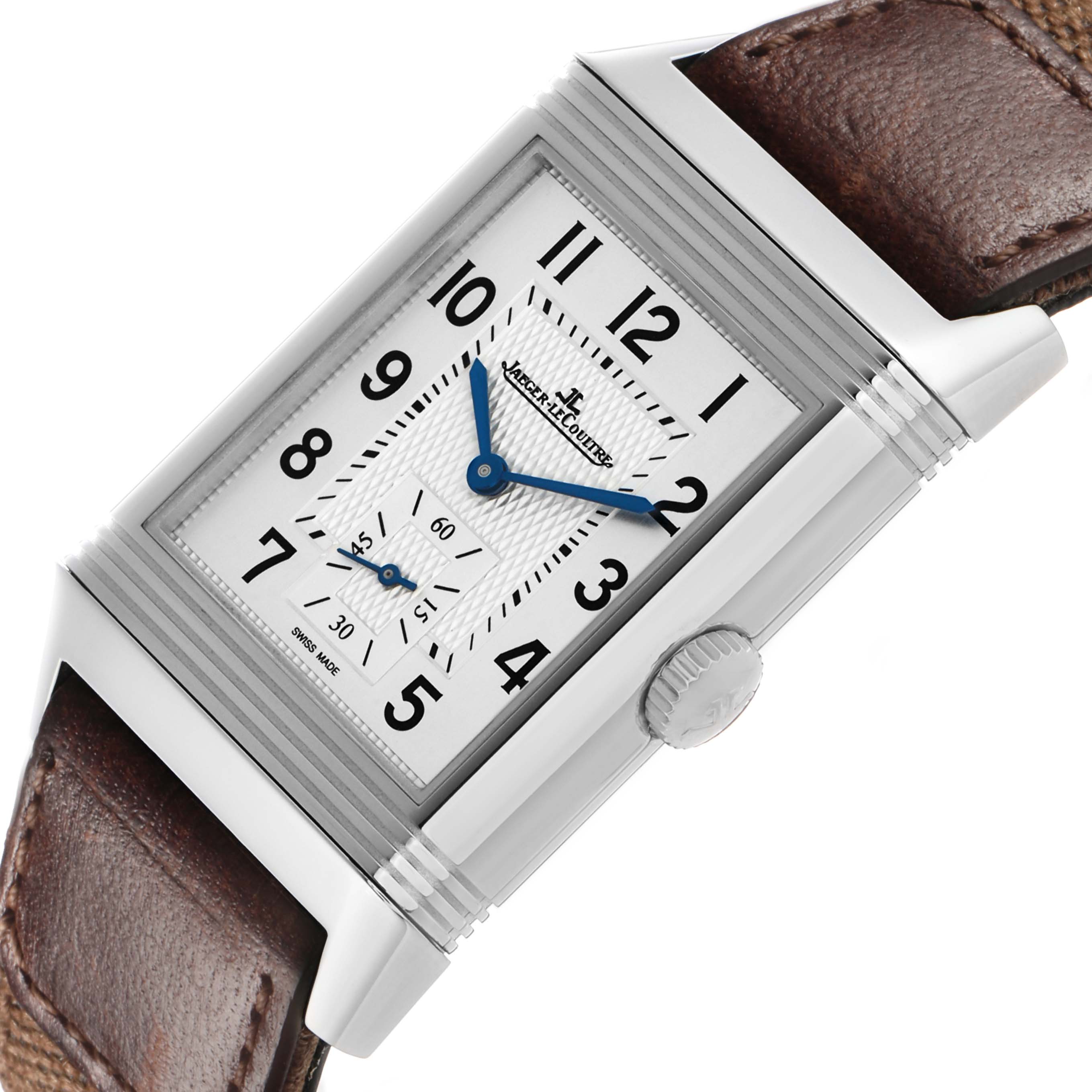 The Jaeger-LeCoultre Reverso watch is angled to show the stainless steel case, crown, white dial, and leather strap.