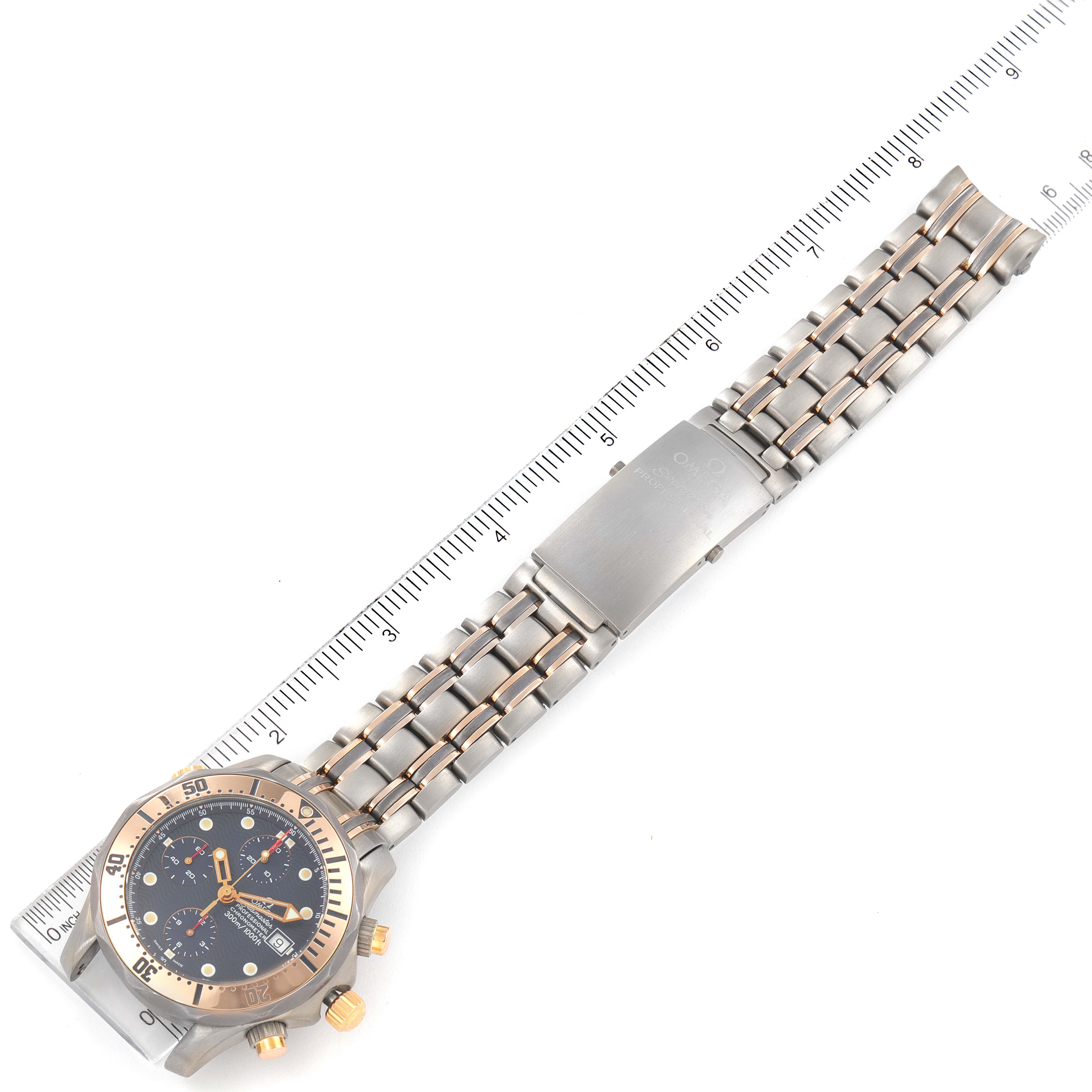 The image shows an Omega Seamaster 2296.80.00 Men's Titanium Blue Dial 2296.80.00 Men's Titanium Blue Dial watch laid flat with a metal band and bezel, captured from an overhead angle alongside a ruler.