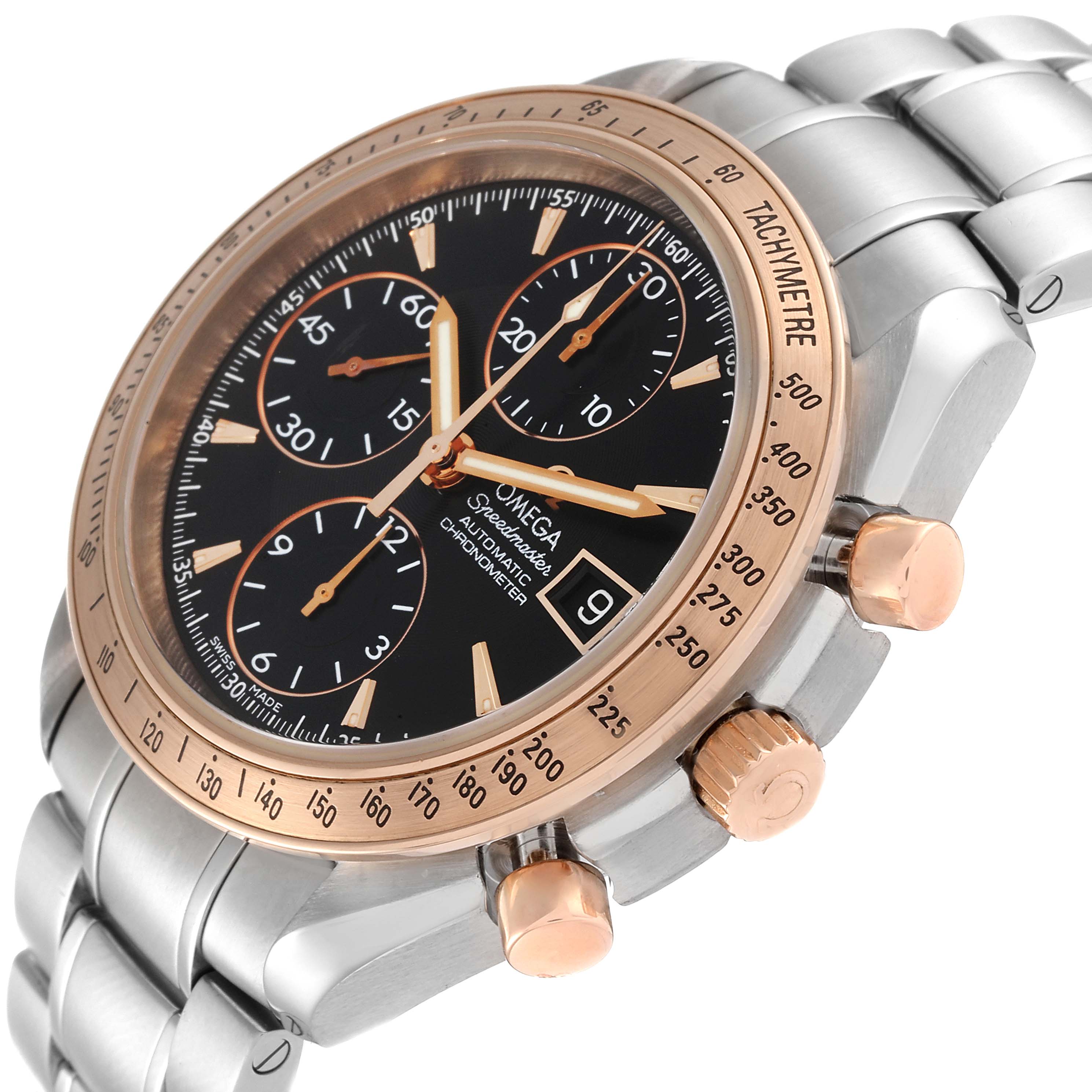 The Omega Speedmaster 323.21.40.40.01.001 Men's Steel and Gold (two tone) Black Dial 323.21.40.40.01.001 Men's Steel and Gold (two tone) Black Dial watch is shown at an angle highlighting the face, tachymeter bezel, crown, pushers, and part of the bracelet.