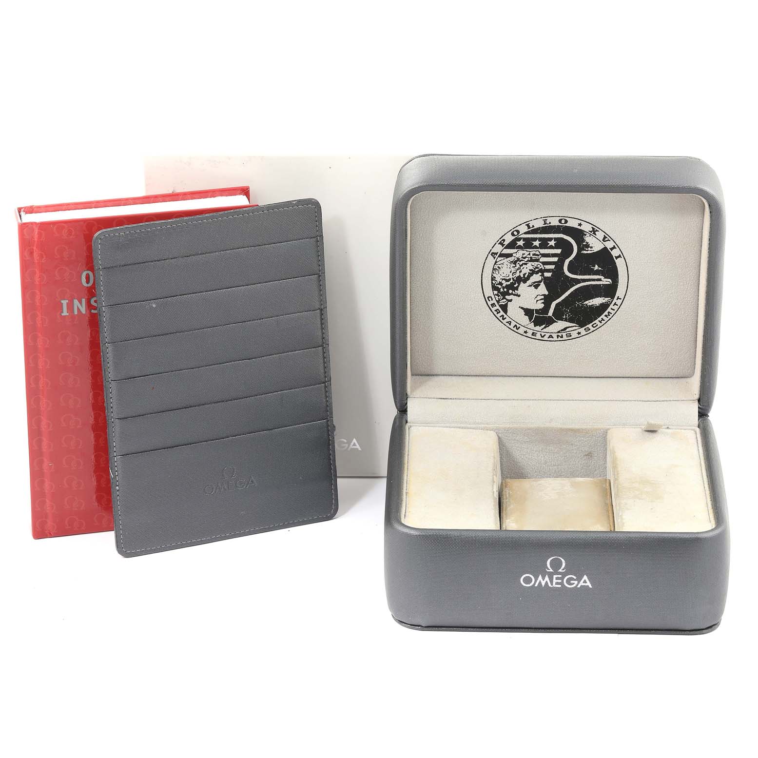 This image shows the packaging, an instruction booklet, and a cardholder for the Omega Speedmaster 323.21.40.40.01.001 Men's Steel and Gold (two tone) Black Dial 323.21.40.40.01.001 Men's Steel and Gold (two tone) Black Dial watch.