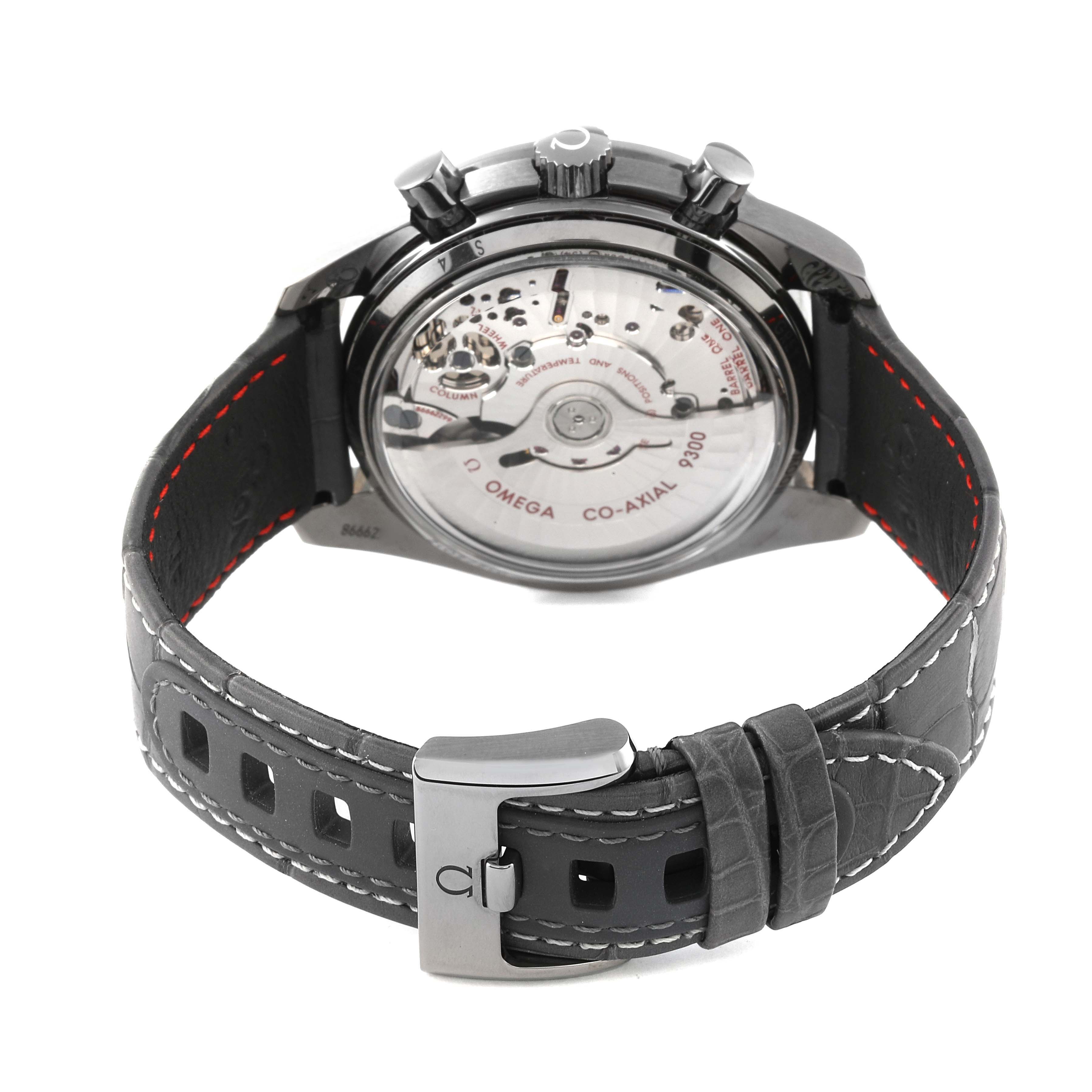 The image shows the back view of an Omega Speedmaster 311.93.44.51.99.001 Men's Ceramic Silver Dial 311.93.44.51.99.001 Men's Ceramic Silver Dial watch, highlighting its movement and leather strap with clasp.