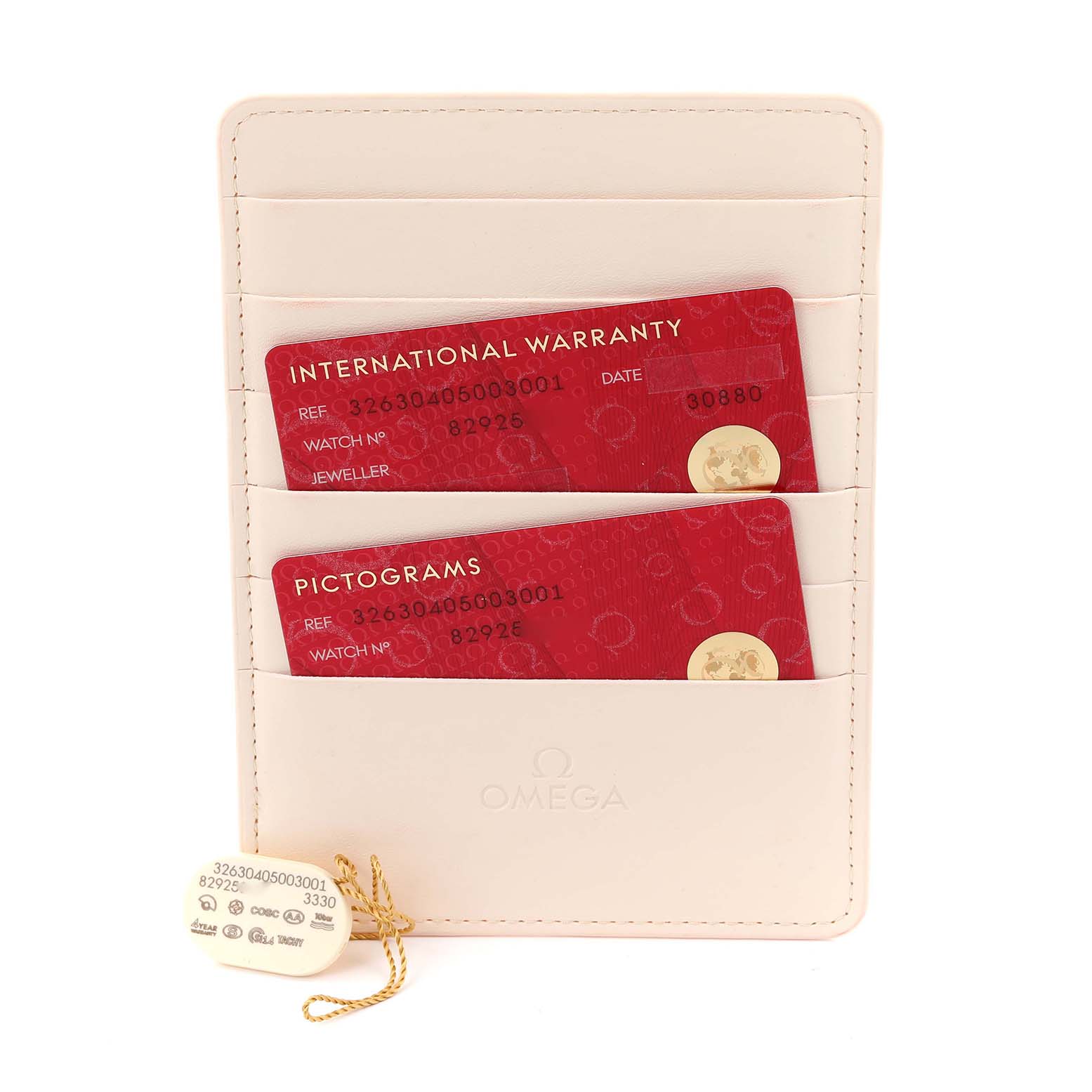 The image shows warranty and pictogram cards in a white wallet, associated with the Omega Speedmaster 326.30.40.50.03.001 Men
s Stainless Steel Blue Dial 326.30.40.50.03.001 Men
s Stainless Steel Blue Dial watch.