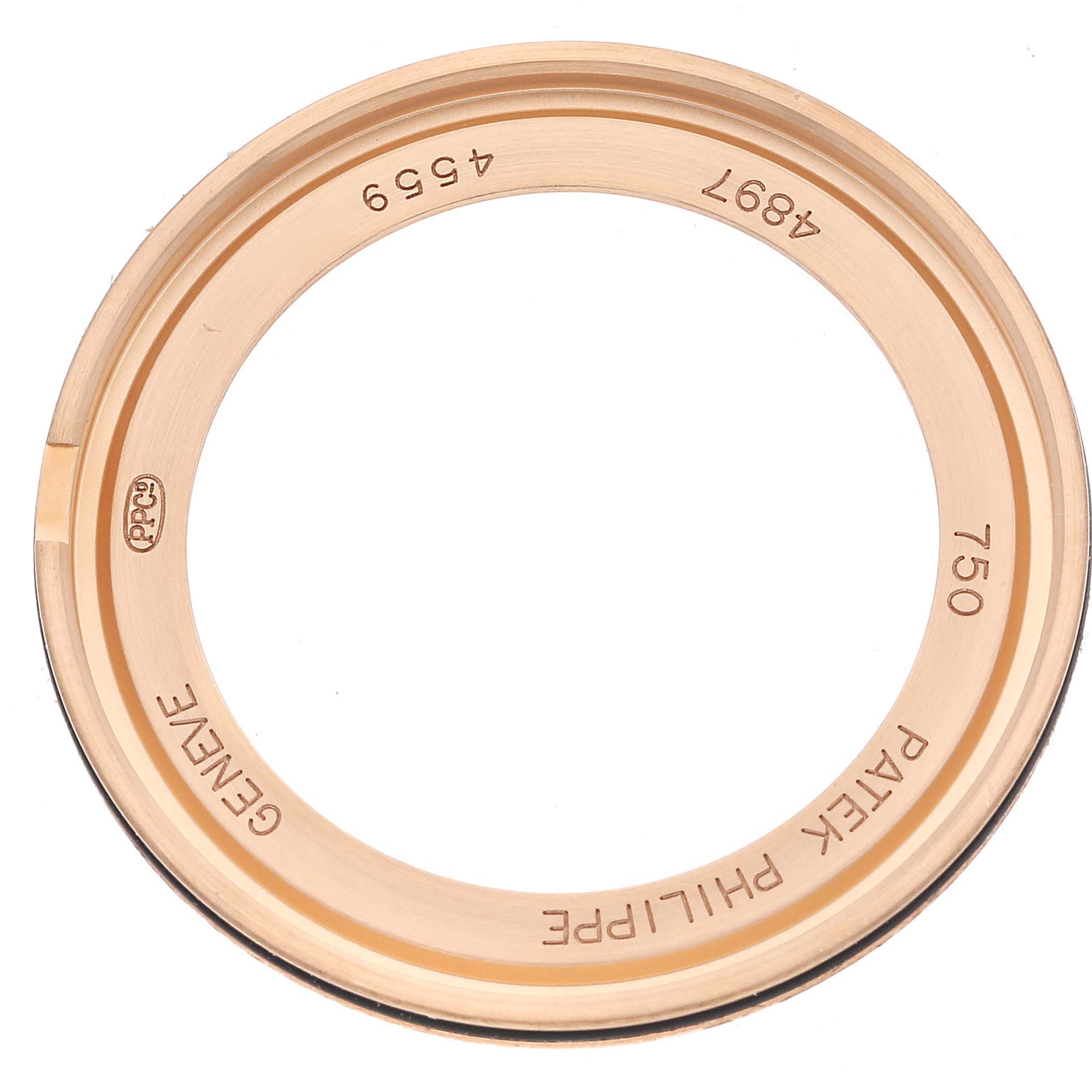 This image shows the circular case back of a Patek Philippe Calatrava 4897R-001 Women's Rose Gold Brown Dial 4897R-001 Women's Rose Gold Brown Dial model, with engravings visible.