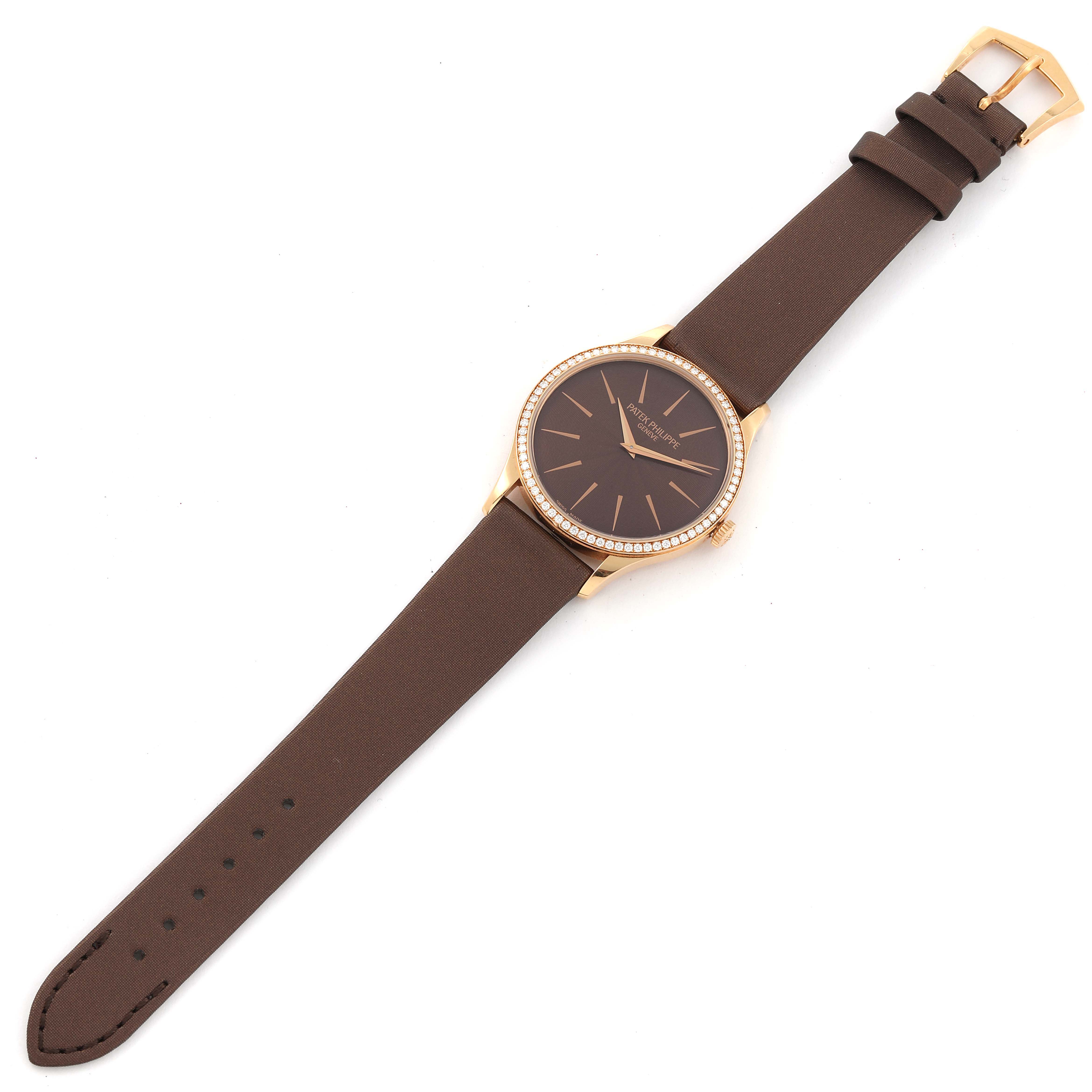 The Patek Philippe Calatrava 4897R-001 Women's Rose Gold Brown Dial 4897R-001 Women's Rose Gold Brown Dial watch is shown from a top view, highlighting the dial, leather strap, and buckle.