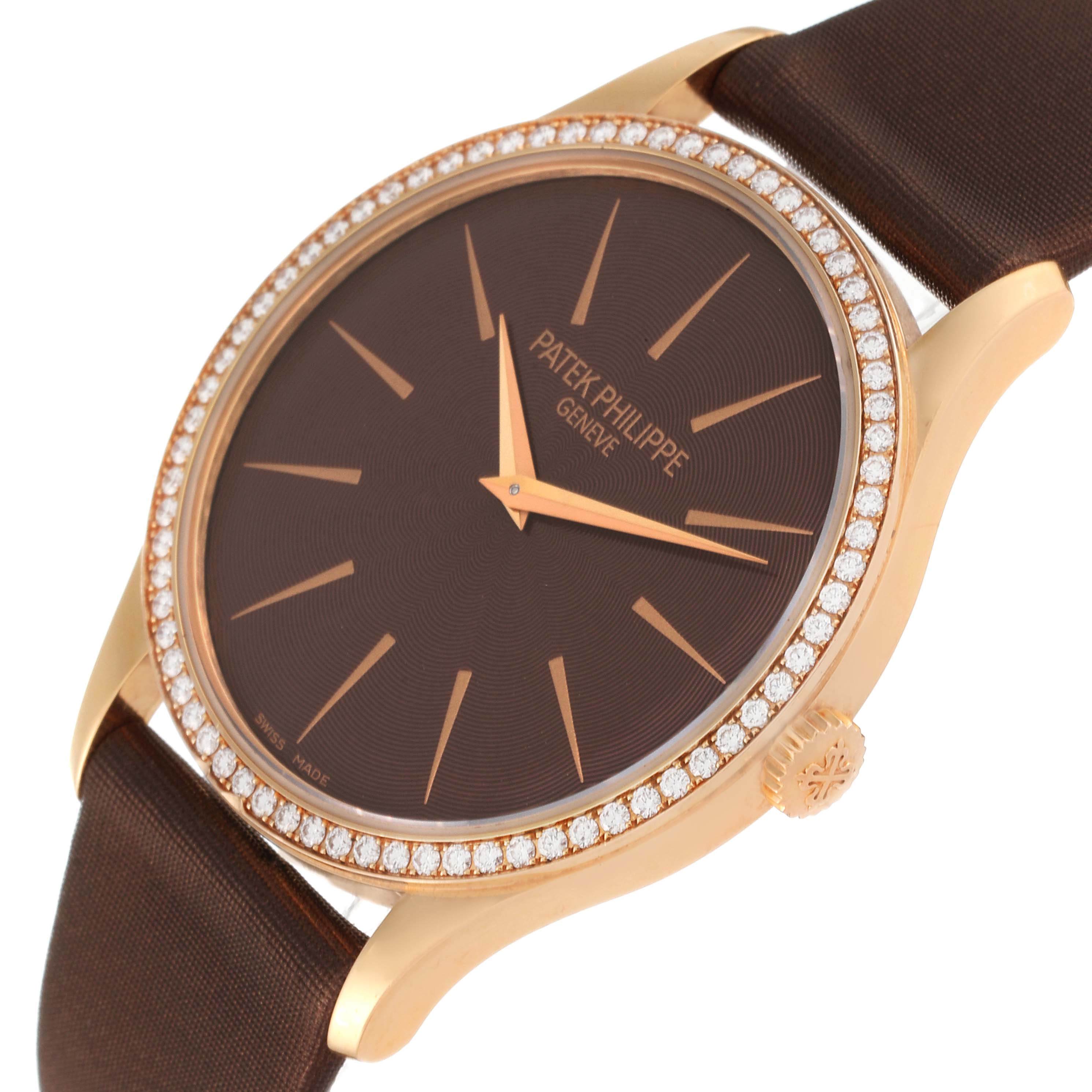 The image shows a close-up of the Patek Philippe Calatrava 4897R-001 Women's Rose Gold Brown Dial 4897R-001 Women's Rose Gold Brown Dial watch's face, bezel, crown, and strap from a slight angle.