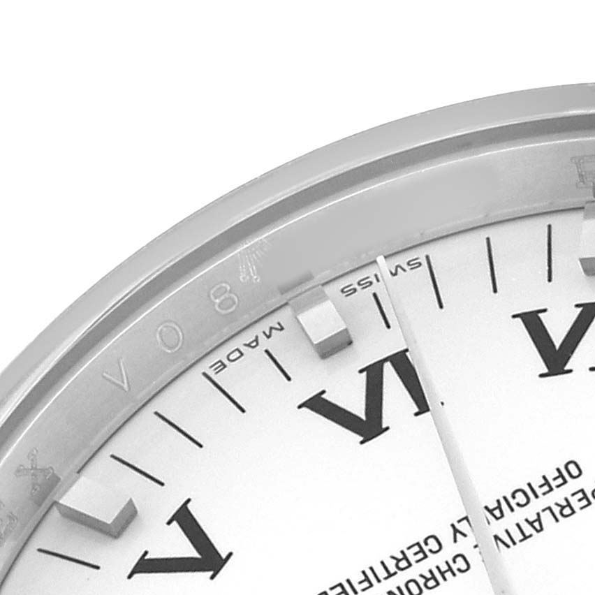 The image shows a close-up of the Rolex Air-King 114200 Men's Stainless Steel White Dial's dial, highlighting the edge of the case and Roman numerals.