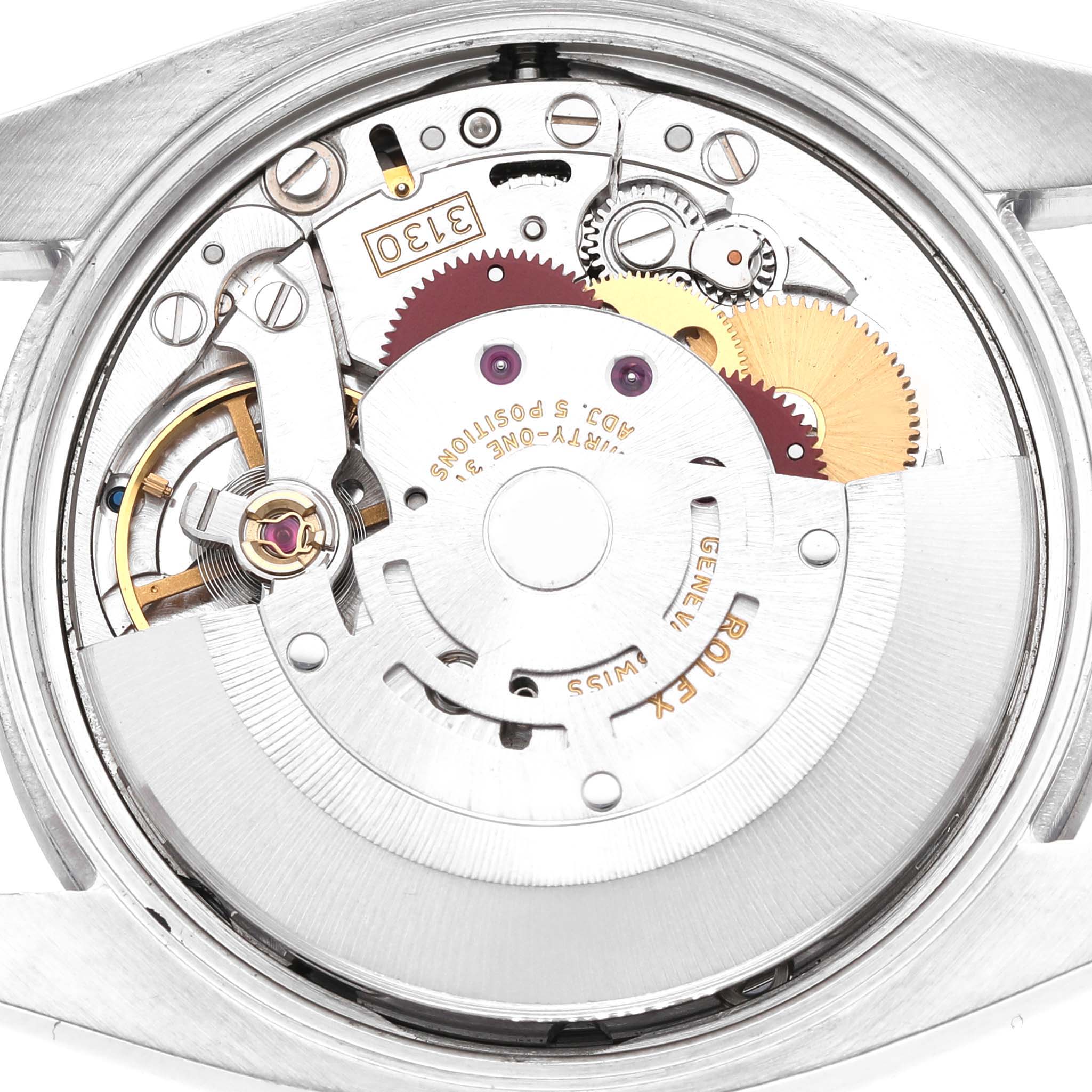 The image shows the internal movement of a Rolex Air-King 114200 Men's Stainless Steel White Dial watch from a top-down angle, highlighting its intricate gears and components.
