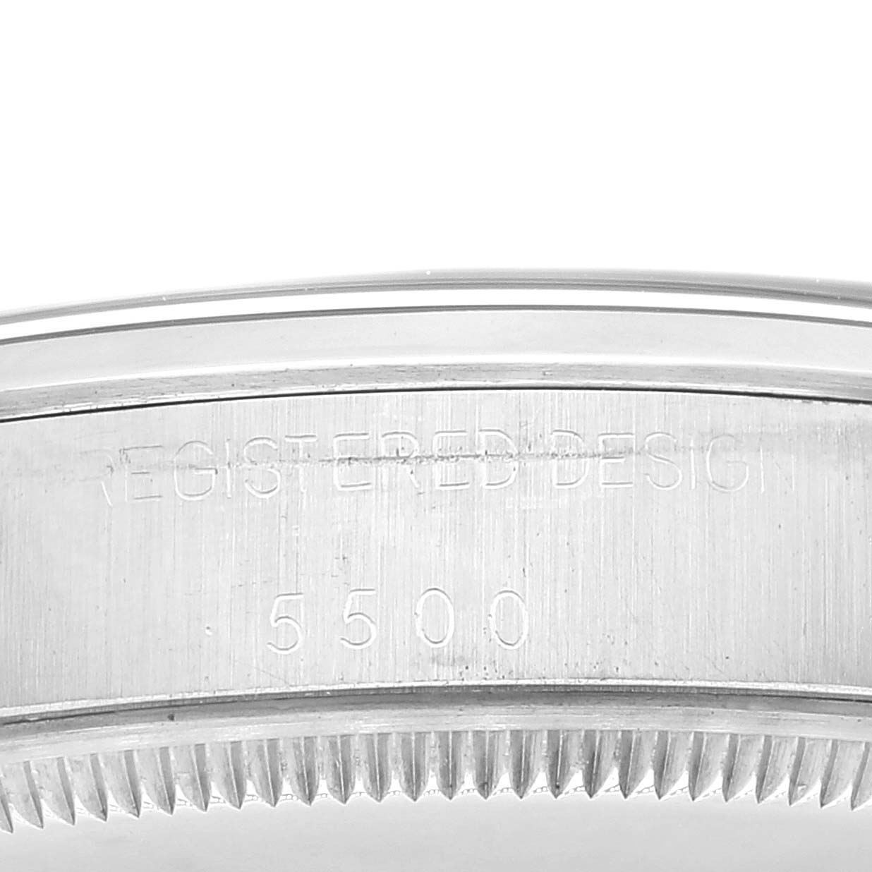 The image shows a close-up of the side engraving on the bezel of a Rolex Air-King 5500 Men's Stainless Steel Silver Dial 5500 Men's Stainless Steel Silver Dial model 5500 watch.