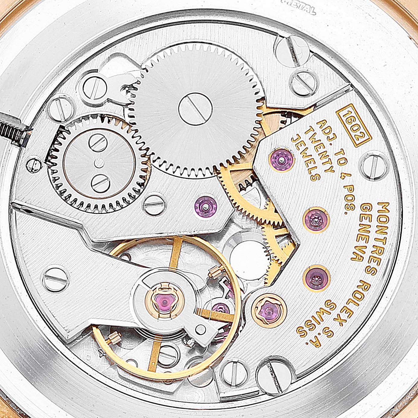 The image shows the intricate internal mechanism of a Rolex Cellini 5112 Men
s Yellow Gold Silver Dial 5112 Men
s Yellow Gold Silver Dial watch from a top-angle view.