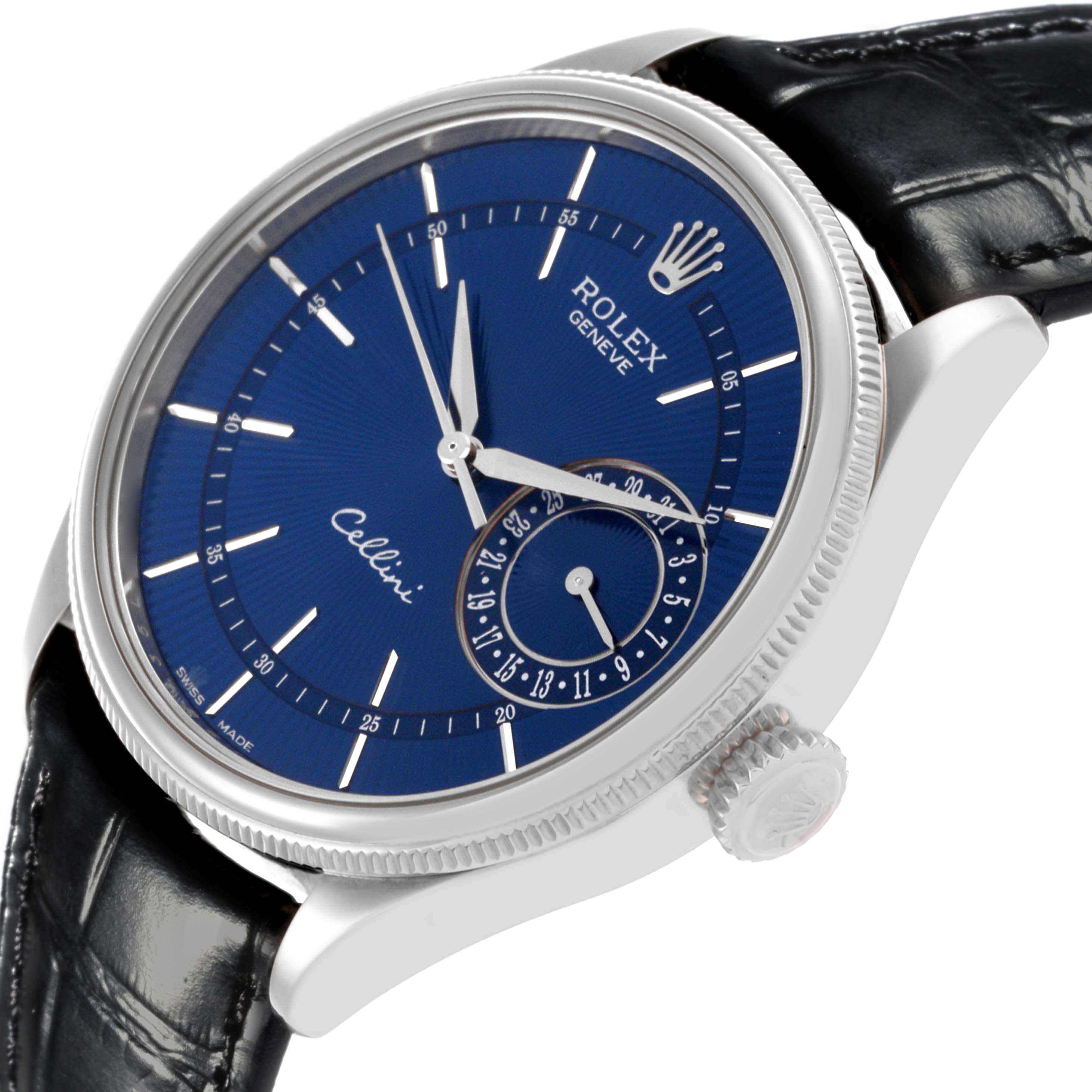 The Rolex Cellini 50519 Men's White Gold Blue Dial 50519 Men's White Gold Blue Dial watch is shown at an angled side view, displaying its blue dial, crown, and black leather strap.
