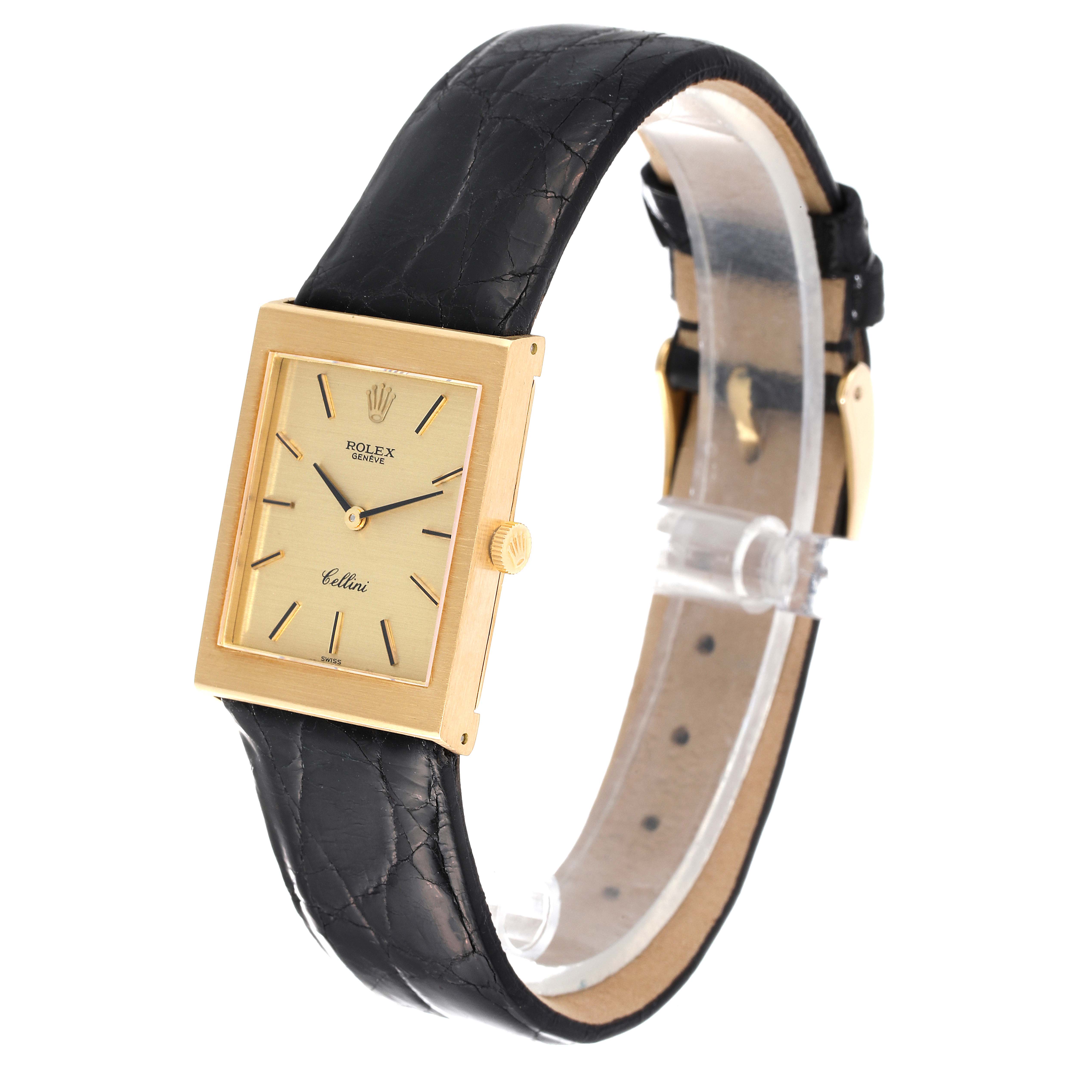 This image shows a side view of a Rolex Cellini 4014 Men's Yellow Gold Champagne Dial 4014 Men's Yellow Gold Champagne Dial watch with a rectangular gold case and a black leather strap.