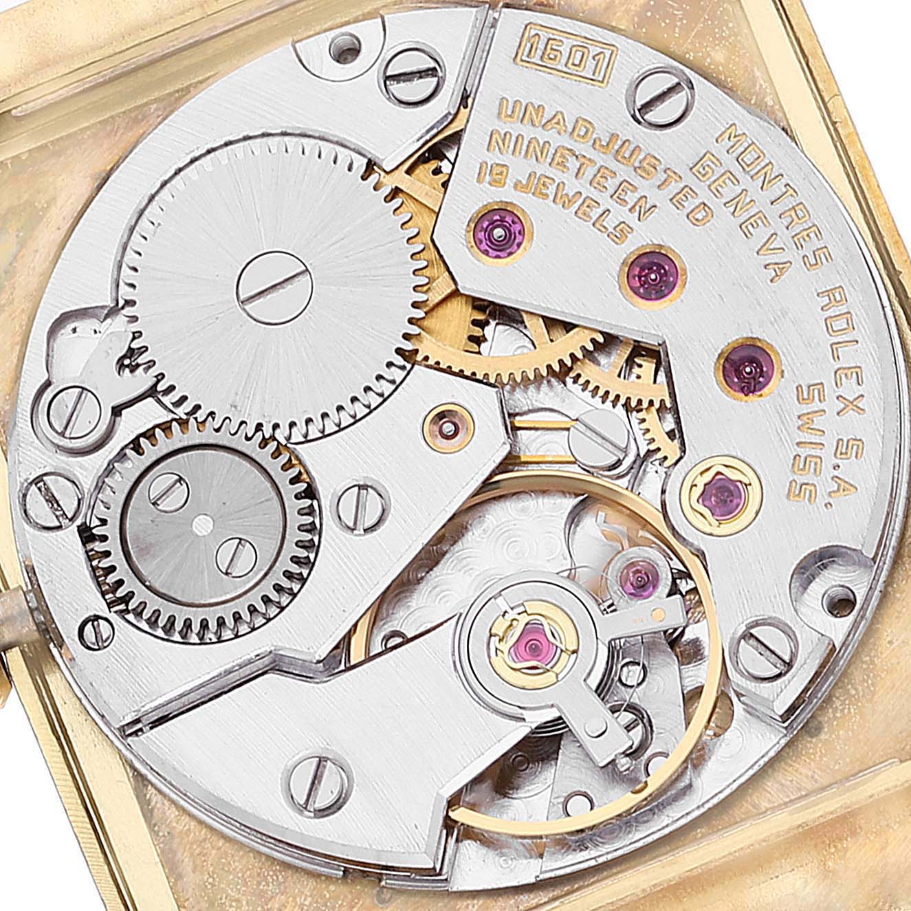 This close-up shows the internal mechanical movement of the Rolex Cellini 4014 Men's Yellow Gold Champagne Dial 4014 Men's Yellow Gold Champagne Dial watch, highlighting gears and intricate components.