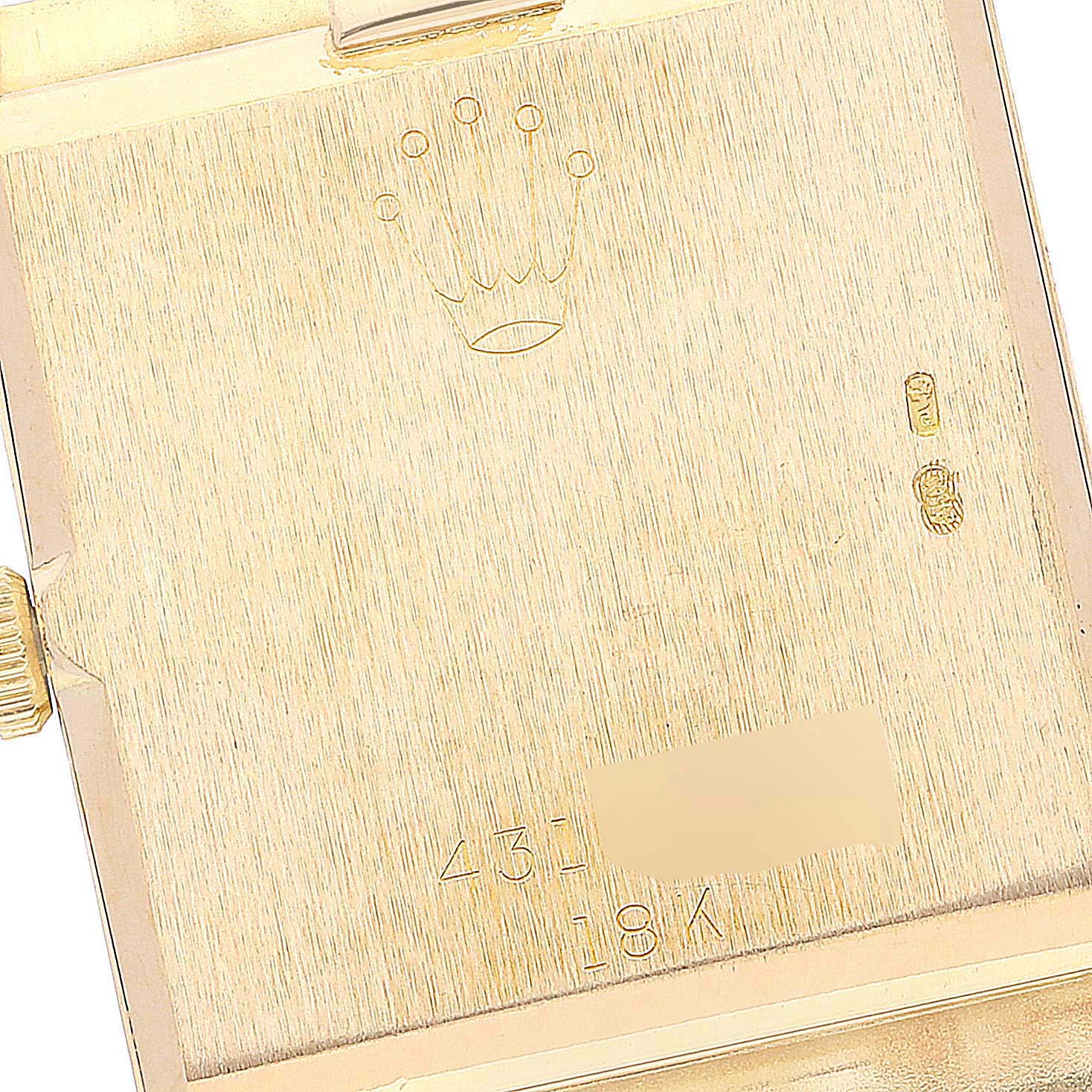 This image shows the back case of a Rolex Cellini 4014 Men's Yellow Gold Champagne Dial 4014 Men's Yellow Gold Champagne Dial watch, highlighting the brand logo and material markings.