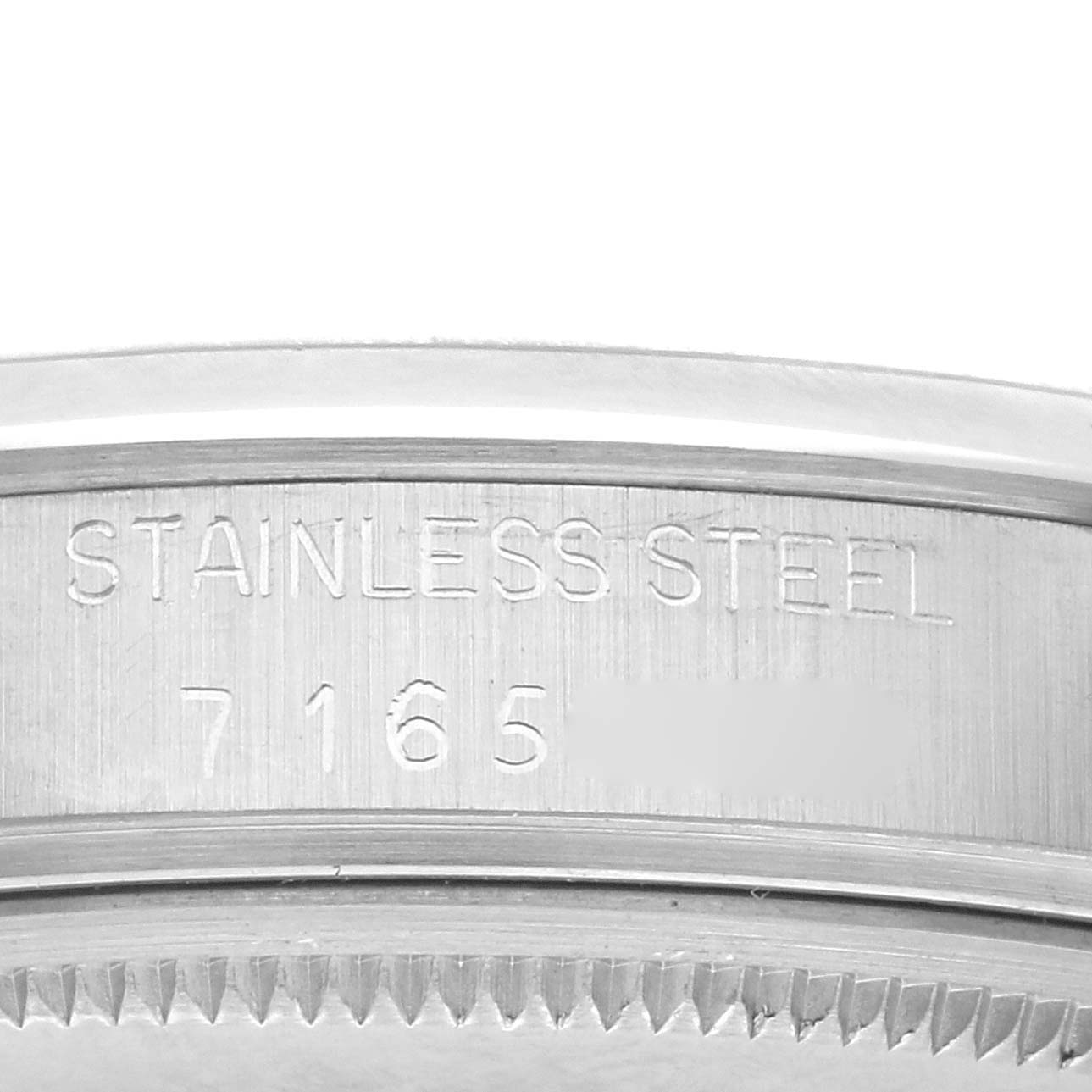 The image shows the side view of a Rolex Date 15000 Men's Stainless Steel Silver Dial 15000 Men's Stainless Steel Silver Dial model, focusing on the stainless steel case with markings and ridged edges.