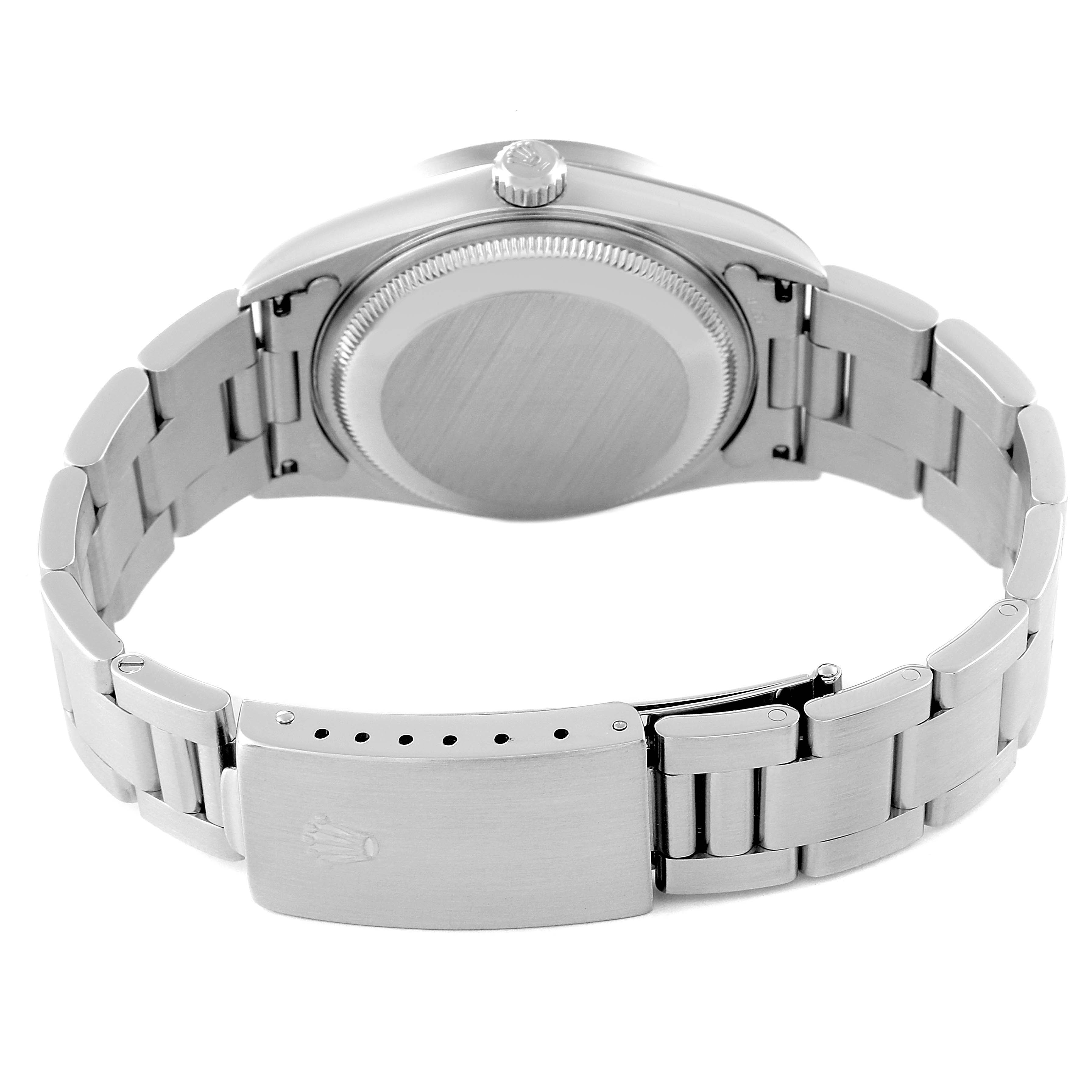 The back view of a Rolex Date 15210 Men's Stainless Steel White Dial 15210 Men's Stainless Steel White Dial model watch showing the case back, crown, and bracelet with clasp.