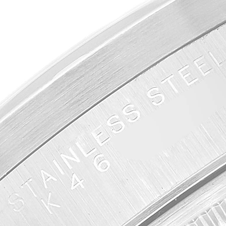 The image shows a close-up of the stainless steel back case with engravings of a Rolex Date 15210 Men's Stainless Steel White Dial 15210 Men's Stainless Steel White Dial model watch. 