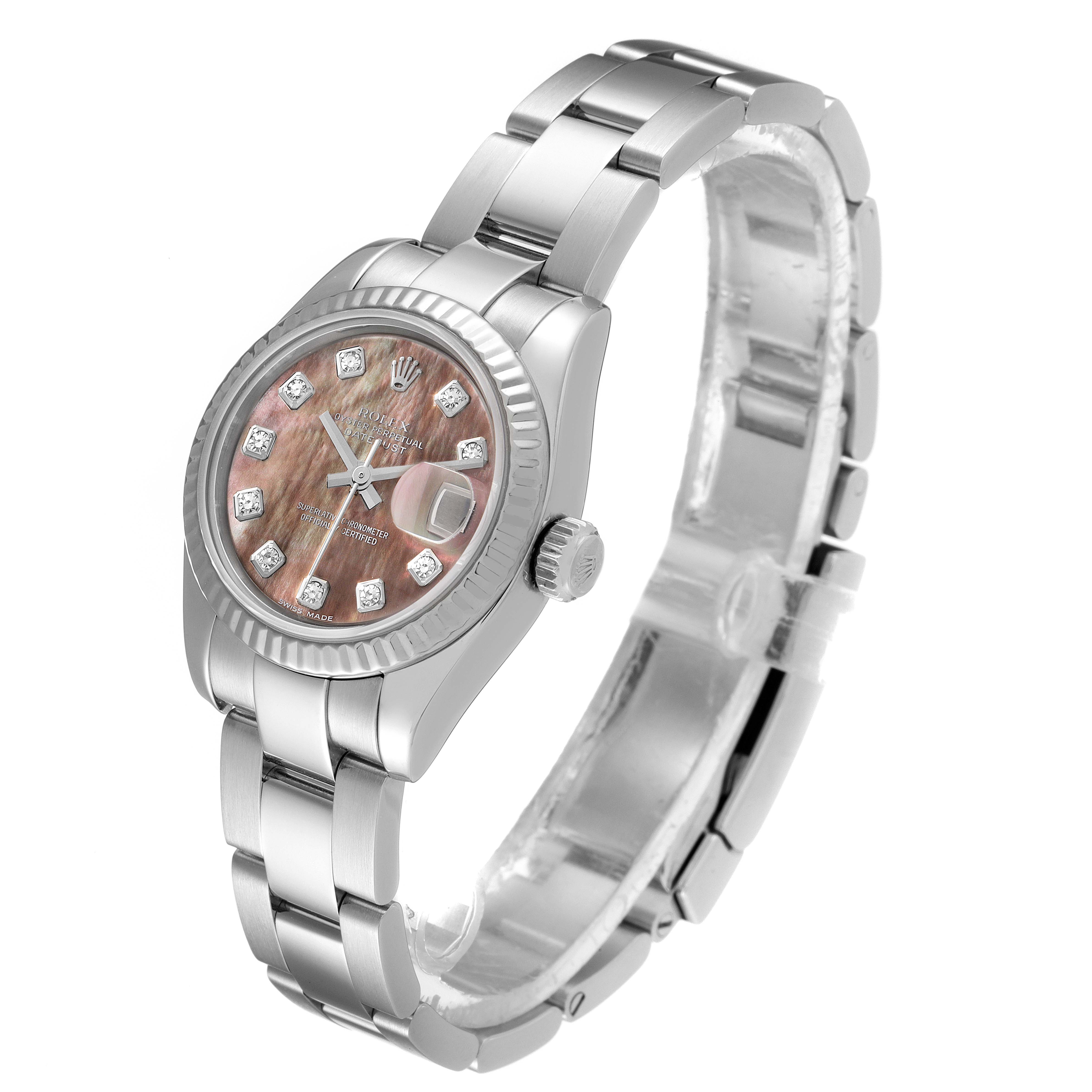 This Rolex Datejust 179174 Women's Stainless Steel Mother of Pearl Dial 179174 Women's Stainless Steel Mother of Pearl Dial watch is shown at a slight side angle, displaying its pink dial, bracelet, and fluted bezel.