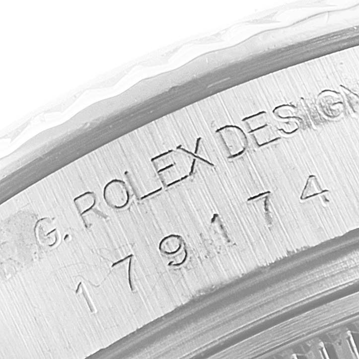 The image shows a close-up of the serial number engraving on the case of a Rolex Datejust 179174 Women's Stainless Steel Mother of Pearl Dial 179174 Women's Stainless Steel Mother of Pearl Dial watch.