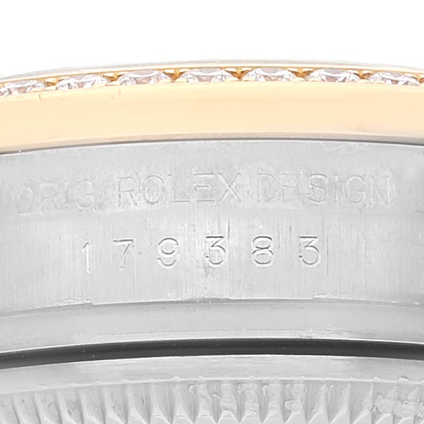 This image shows a close-up of the side of a Rolex Datejust 179383 Women's Steel and Gold (two tone) Champagne Dial 179383 Women's Steel and Gold (two tone) Champagne Dial watch, focusing on the model and serial number engraving.