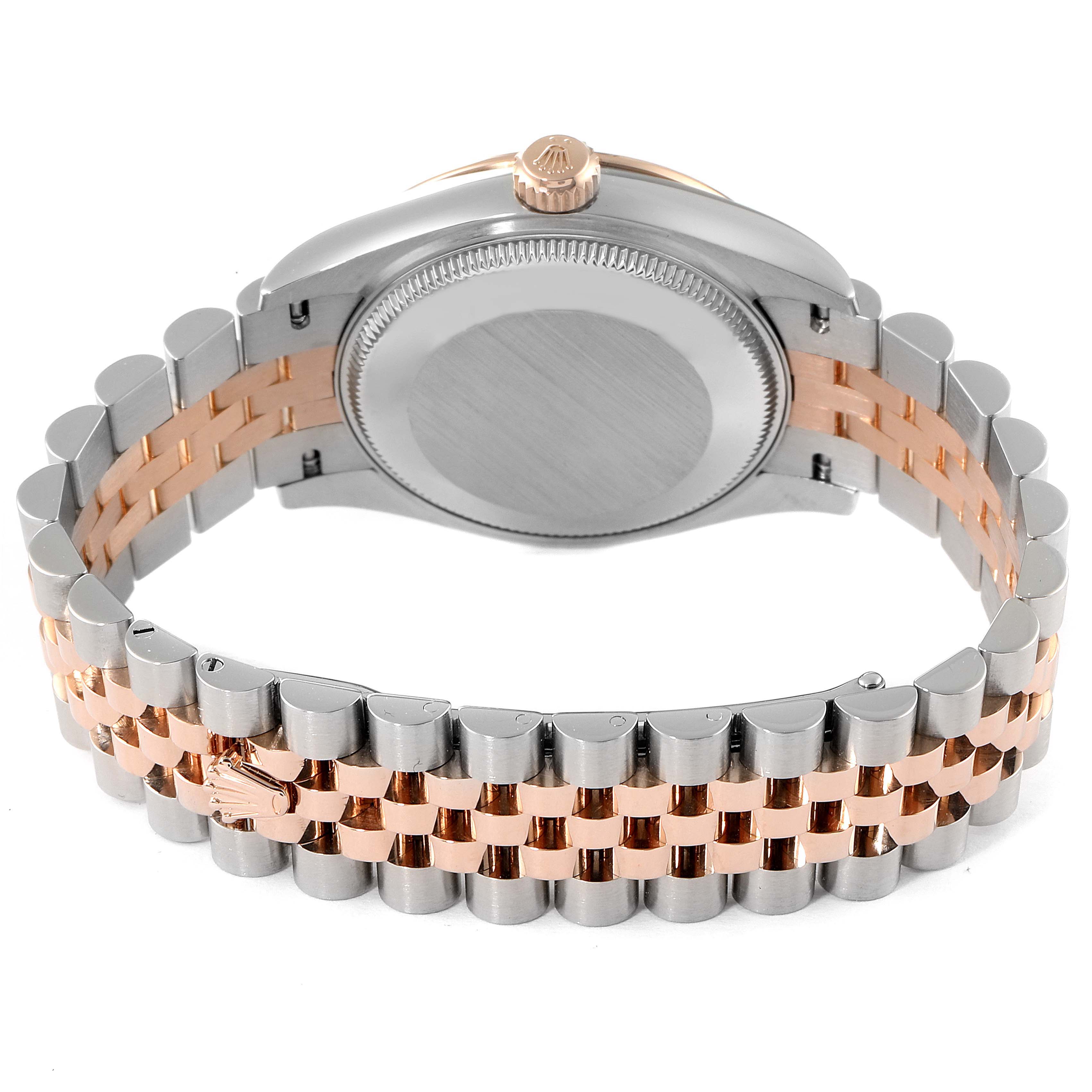 The image shows the back of a Mid-Size Rolex watch, displaying its case back, crown, and two-tone bracelet.