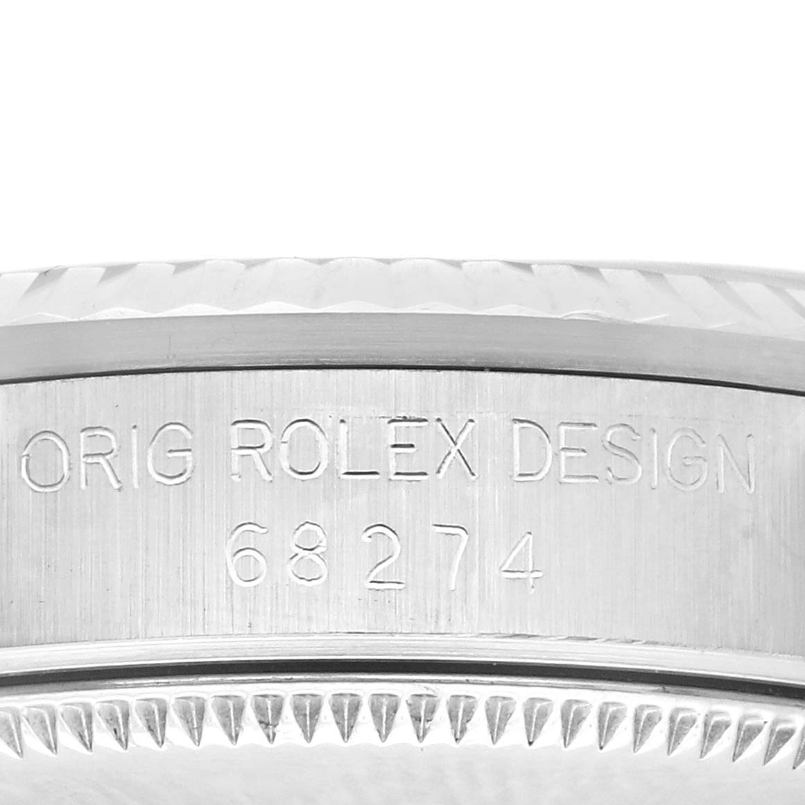 The image shows the side engraving on a Rolex Mid-Size 68274 Women's Stainless Steel Silver Dial 68274 Women's Stainless Steel Silver Dial model, featuring the serial number and "Orig Rolex Design."