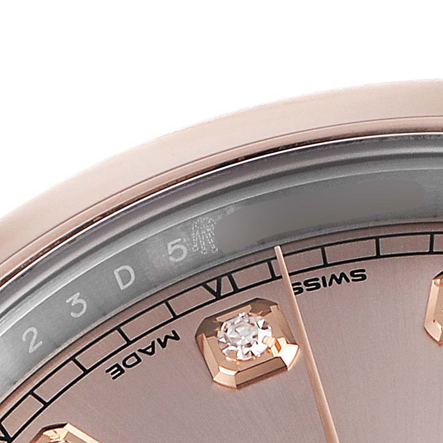 This close-up image shows the dial and part of the bezel of a Rolex Datejust 41 126301 Men's Steel and Gold (two tone) Pink Dial 126301 Men's Steel and Gold (two tone) Pink Dial watch.