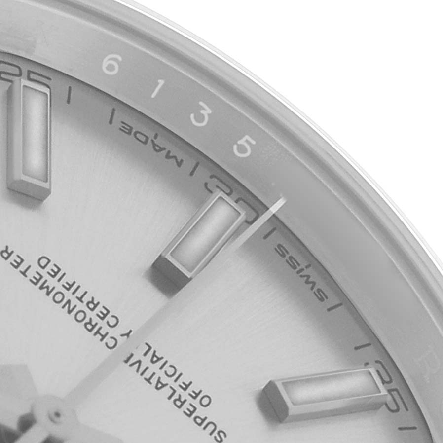 The image shows a close-up of the dial and markers on a Rolex Datejust 41 126300 Men's Stainless Steel Silver Dial, focusing on the indices and "Swiss Made" text.