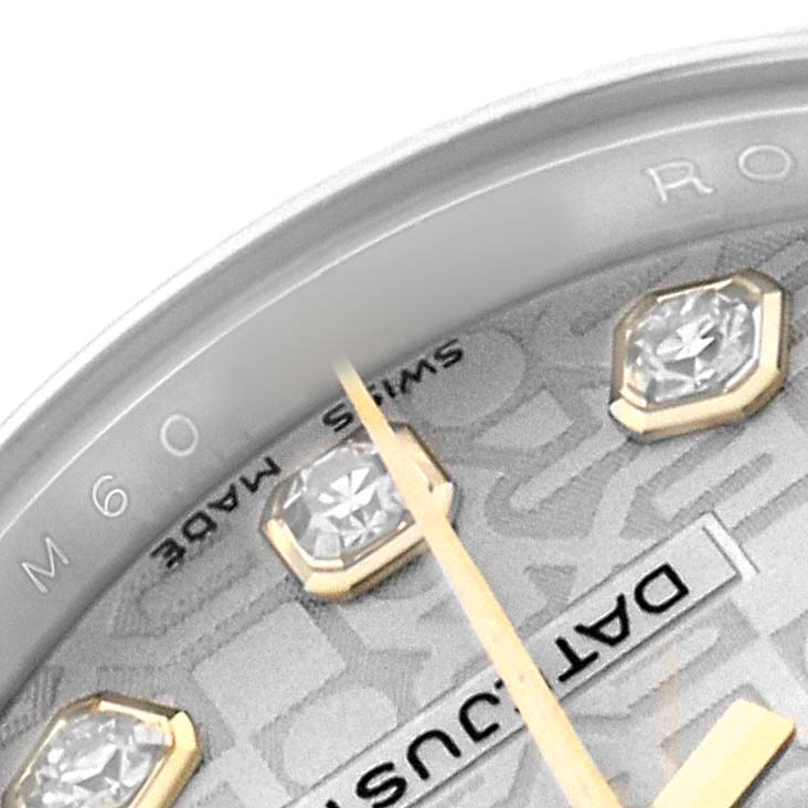 The image shows a close-up of a Rolex Datejust 179173 Women's Steel and Gold (two tone) Silver Dial dial featuring diamond hour markers and part of the second hand.