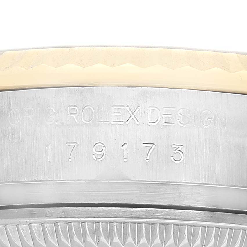 The image shows the side of the Rolex Datejust 179173 Women's Steel and Gold (two tone) Silver Dial case, highlighting the model number and engraved details.