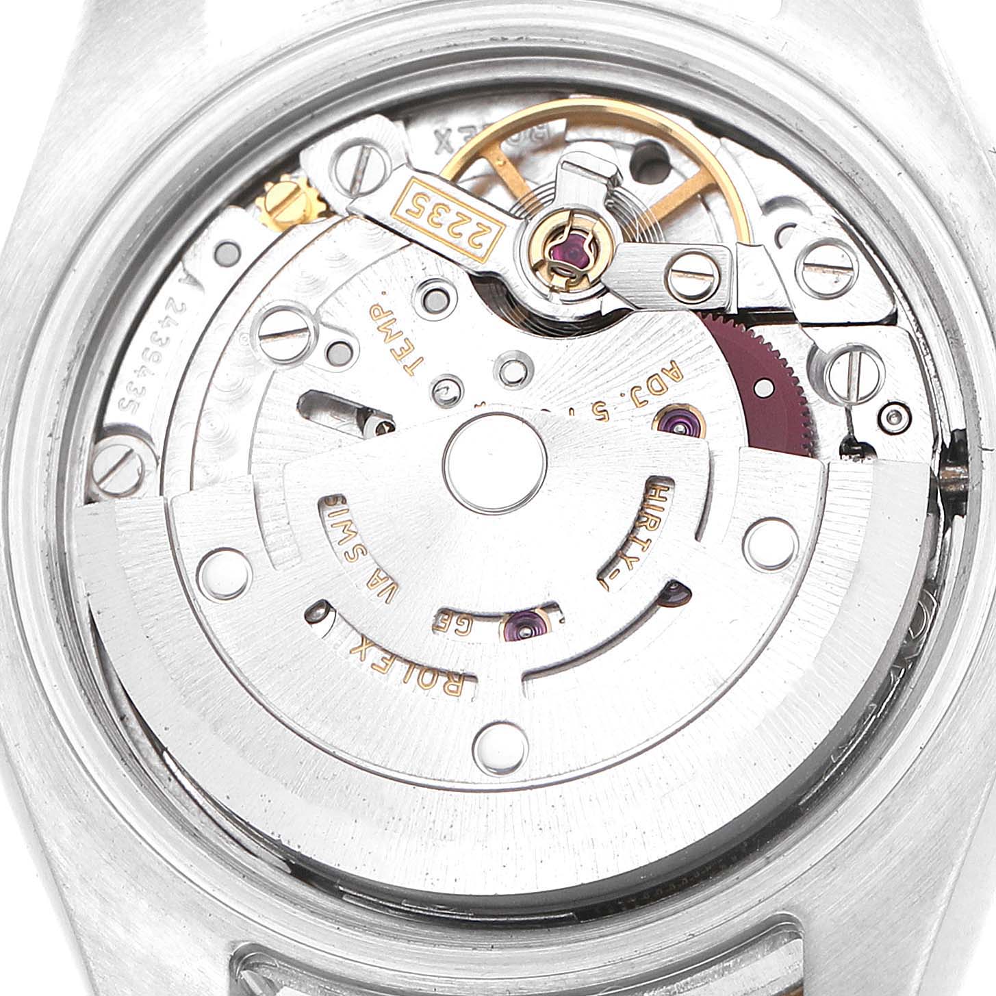 The image shows the internal movement of a Rolex Datejust 179173 Women's Steel and Gold (two tone) Silver Dial watch from a top-down angle, highlighting gears and components.
