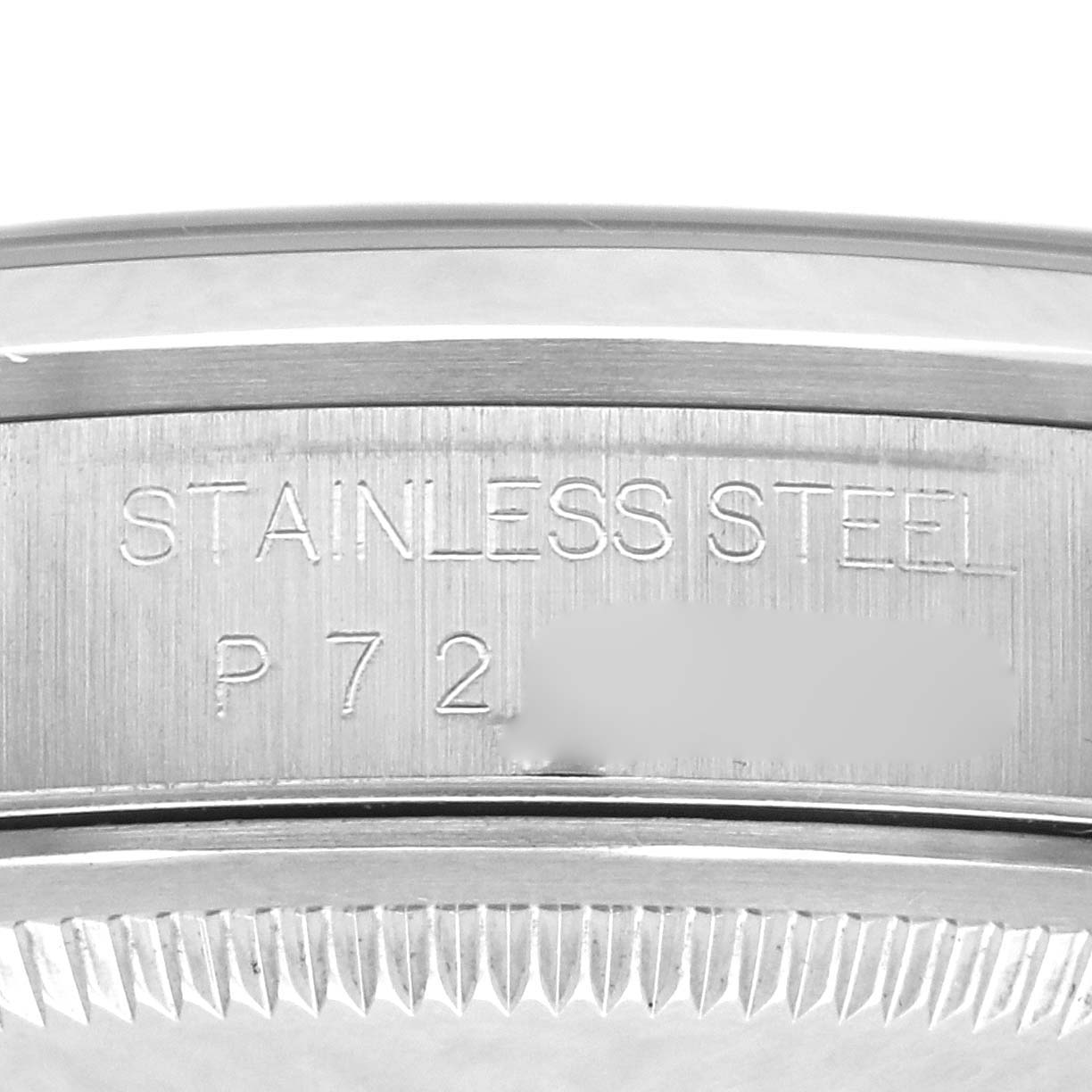 The image shows a close-up of the Rolex Datejust 16200 Men's Stainless Steel Blue Dial 16200 Men's Stainless Steel Blue Dial watch's inner rim with "STAINLESS STEEL" engraved.