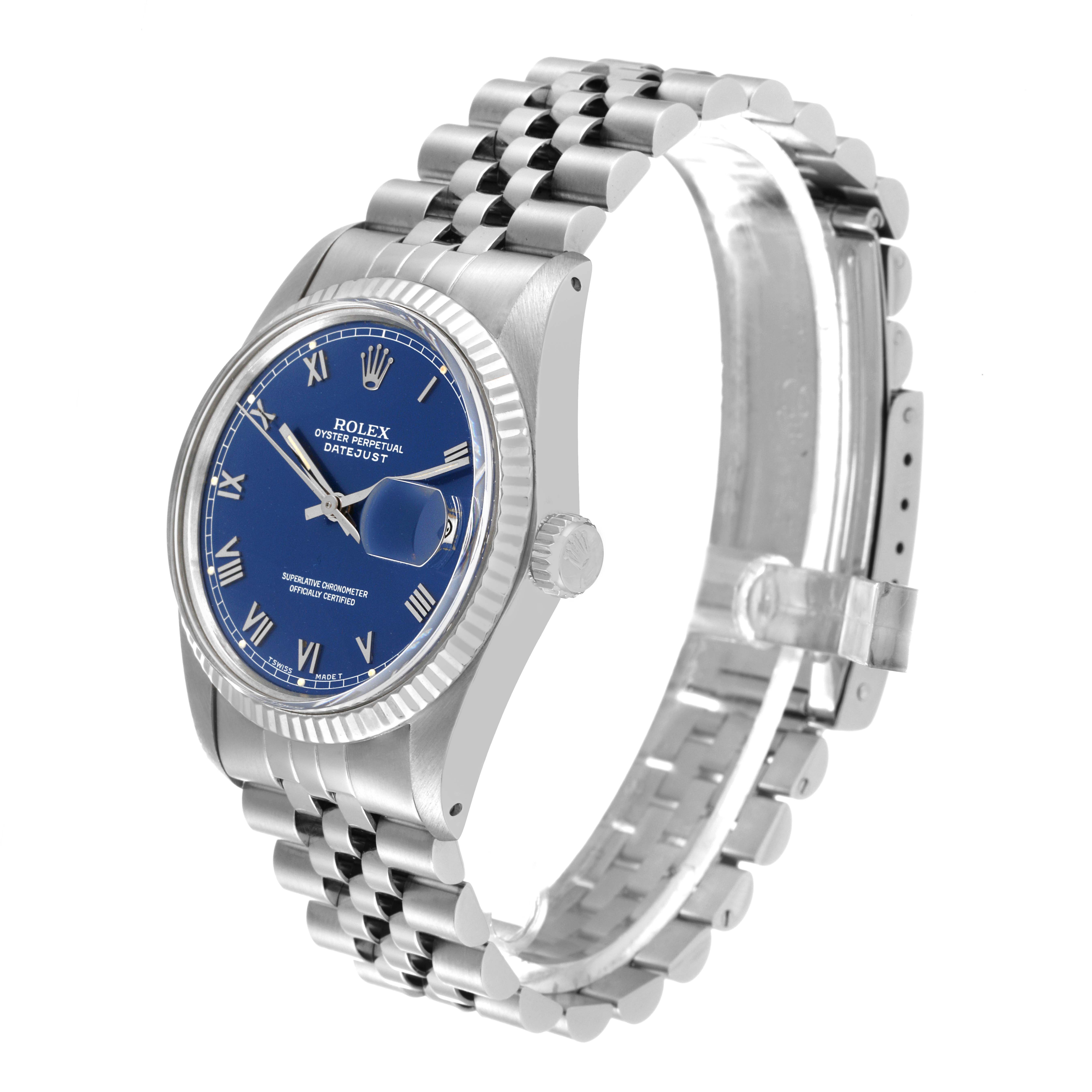 The image shows a Rolex Datejust 16014 Men's Stainless Steel Blue Dial 16014 Men's Stainless Steel Blue Dial watch at an angle that highlights its blue dial, fluted bezel, and Jubilee bracelet.