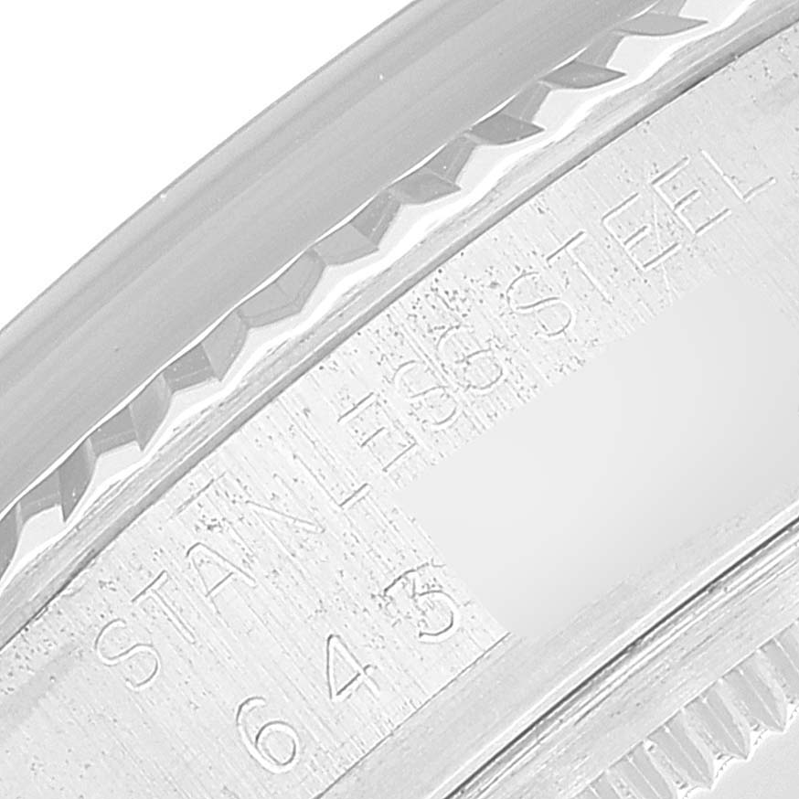 This image shows a close-up angle of the casing edge and engraved text on a stainless steel Rolex Datejust 16014 Men's Stainless Steel Blue Dial 16014 Men's Stainless Steel Blue Dial watch.