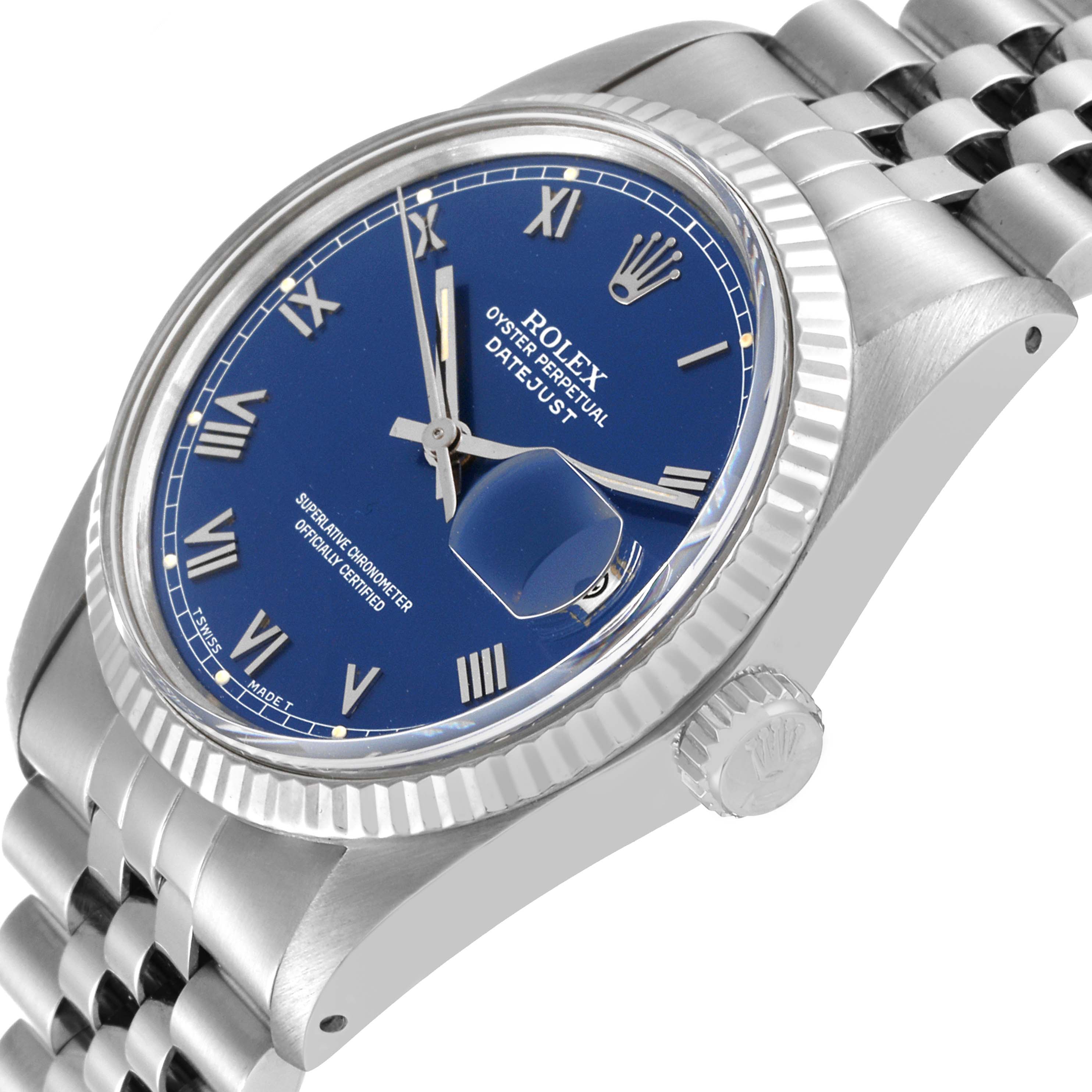 This Rolex Datejust 16014 Men's Stainless Steel Blue Dial 16014 Men's Stainless Steel Blue Dial watch is shown at a slightly angled close-up, highlighting the blue dial, silver bezel, and crown.