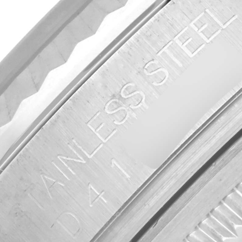 This close-up shows the side engraving of a Rolex Datejust 116234 Men's Stainless Steel Silver Dial 116234 Men's Stainless Steel Silver Dial, focusing on the stainless steel part.