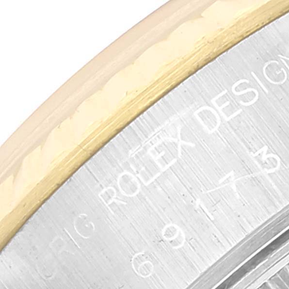 The image shows a close-up of the case back and partial bezel of a Rolex Datejust 69173 Women's Steel and Gold (two tone) Beige Dial 69173 Women's Steel and Gold (two tone) Beige Dial watch.