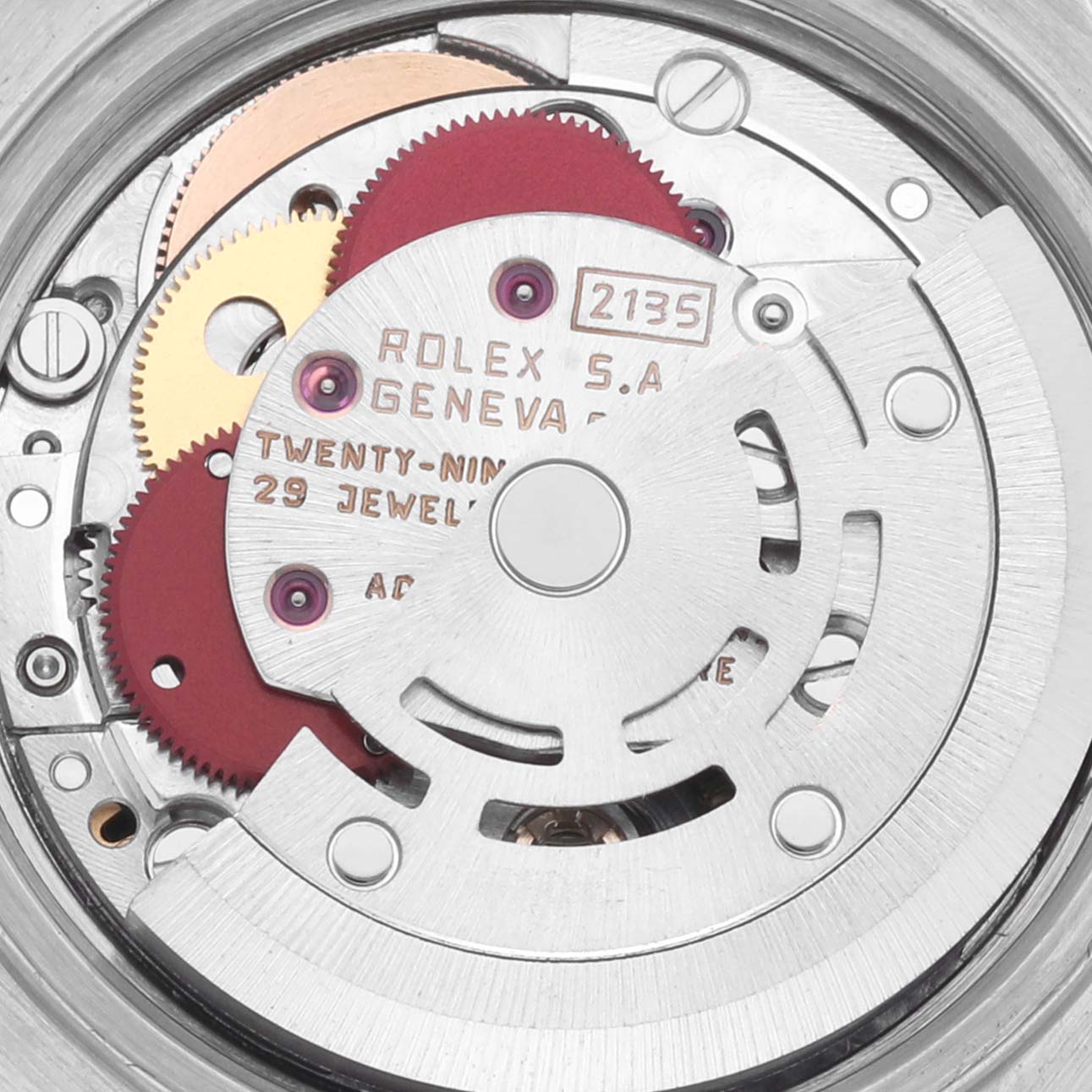 The image shows the intricate internal movement of the Rolex Datejust 69173 Women's Steel and Gold (two tone) Black Dial 69173 Women's Steel and Gold (two tone) Black Dial watch, focusing on gears and jewels.