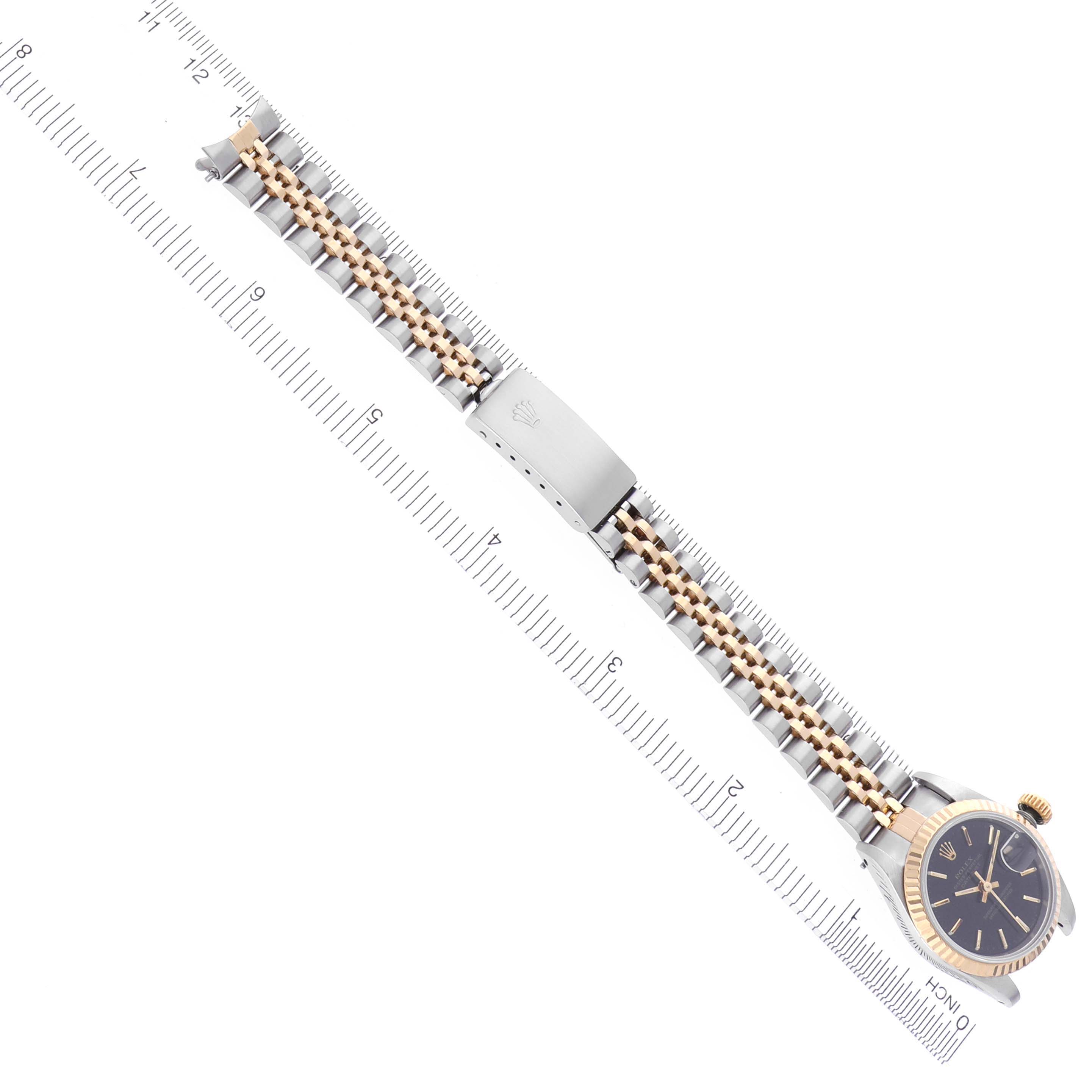 The image shows a Rolex Datejust 69173 Women's Steel and Gold (two tone) Black Dial 69173 Women's Steel and Gold (two tone) Black Dial watch from an overhead angle, featuring the full bracelet laid flat with a ruler for scale.