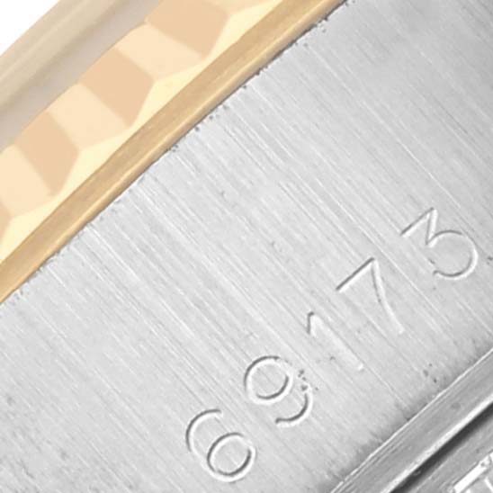 The image shows a close-up of a Rolex Datejust 69173 Women's Steel and Gold (two tone) Black Dial 69173 Women's Steel and Gold (two tone) Black Dial's side, focusing on the bezel and case with engraved numbers.