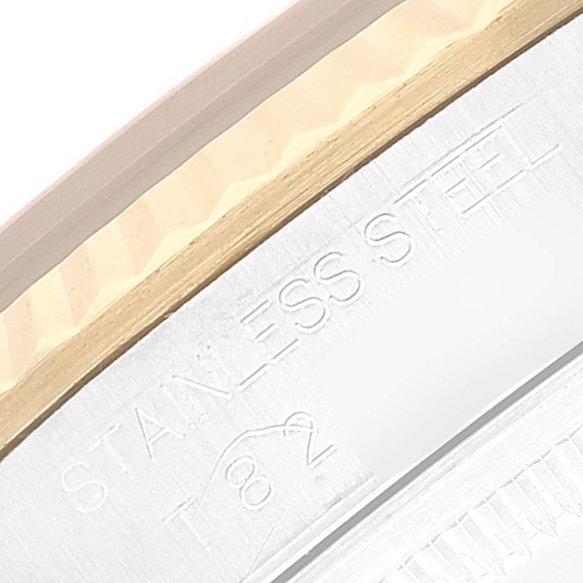 This image shows a close-up of the stainless steel bezel and case back edge of a Rolex Datejust 16233 Men's Steel and Gold (two tone) Black Dial 16233 Men's Steel and Gold (two tone) Black Dial watch.