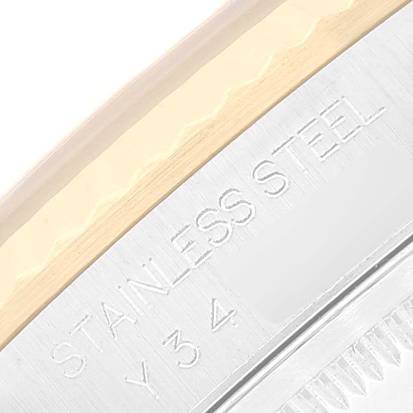This image shows a close-up of the engraved "STAINLESS STEEL" and partial reference details on the back of a Rolex Datejust 16233 Men's Steel and Gold (two tone) Black Dial 16233 Men's Steel and Gold (two tone) Black Dial watch.