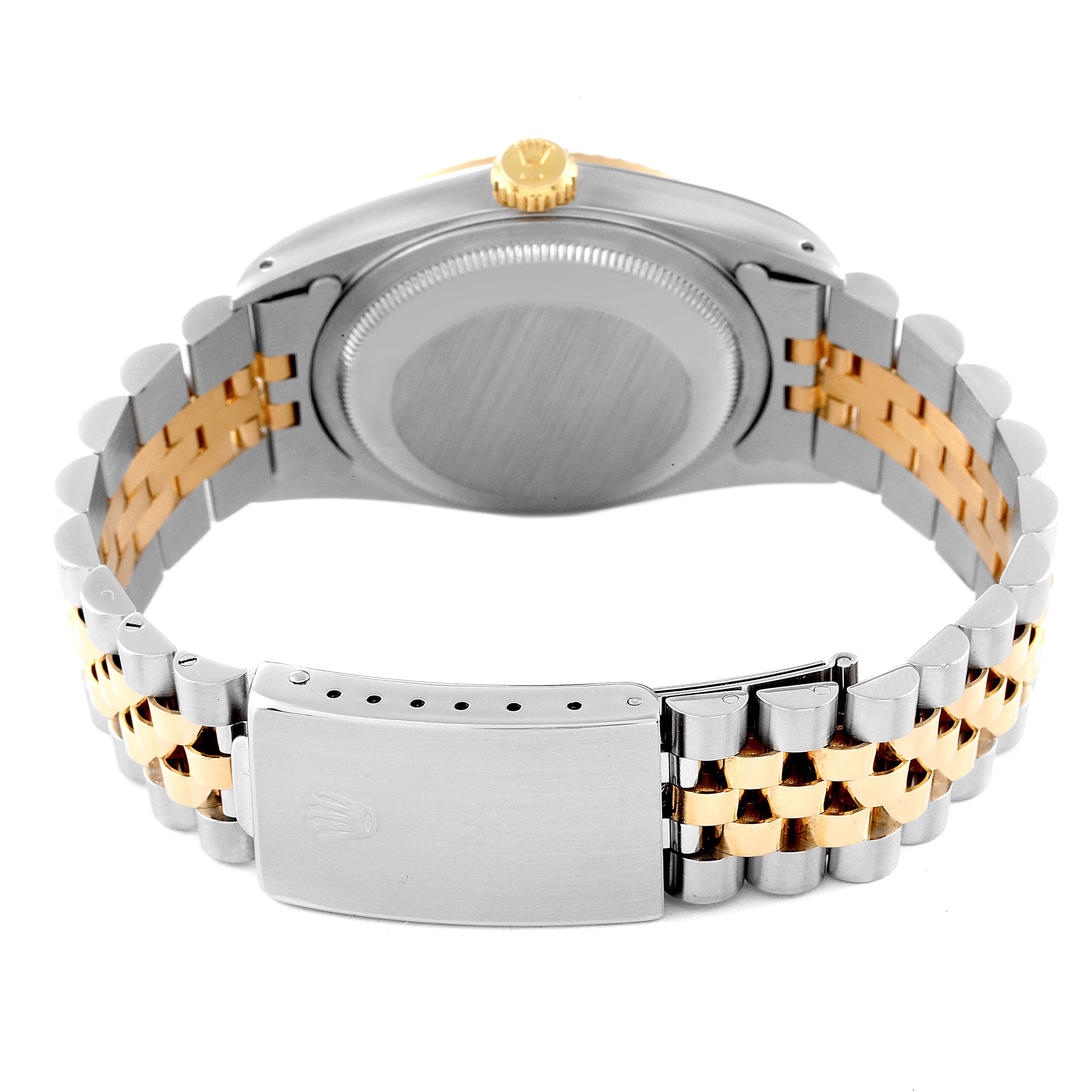 The image shows the back view of a Rolex Datejust 16233 Men's Steel and Gold (two tone) Black Dial 16233 Men's Steel and Gold (two tone) Black Dial watch, highlighting its case back and two-tone bracelet with clasp.