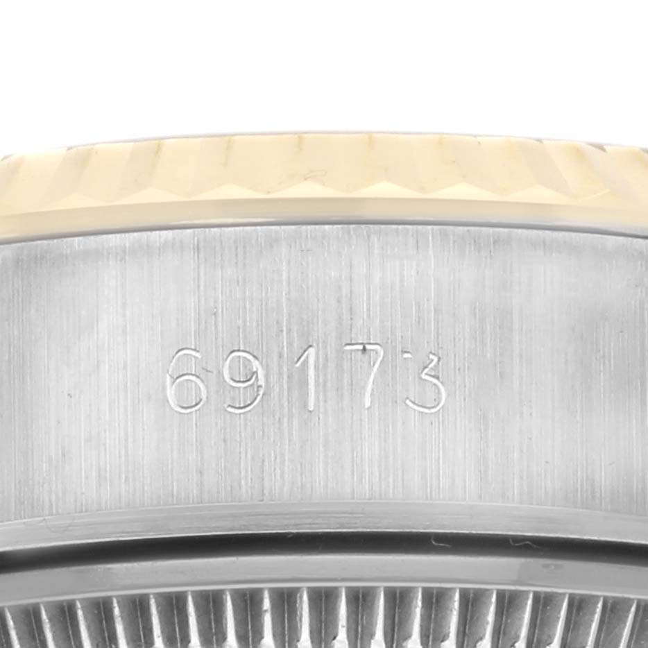 The image shows the side view of the Rolex Datejust 69173 Women's Steel and Gold (two tone) Champagne Dial 69173 Women's Steel and Gold (two tone) Champagne Dial, focusing on the case with a visible model number "69173."