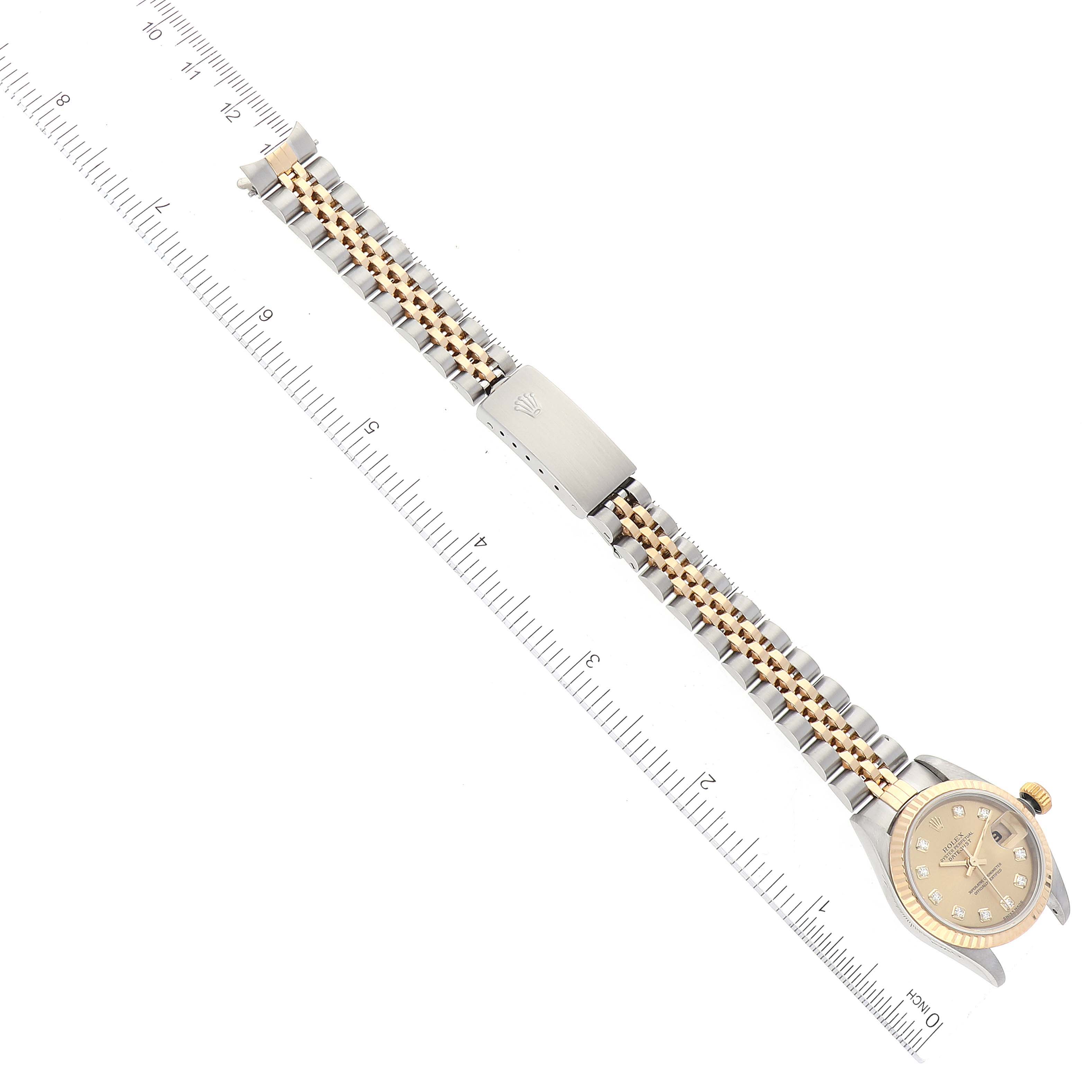 The image shows a top-down view of a Rolex Datejust 79173 Women's Steel and Gold (two tone) Champagne Dial 79173 Women's Steel and Gold (two tone) Champagne Dial watch, displaying the dial, bracelet, and clasp.
