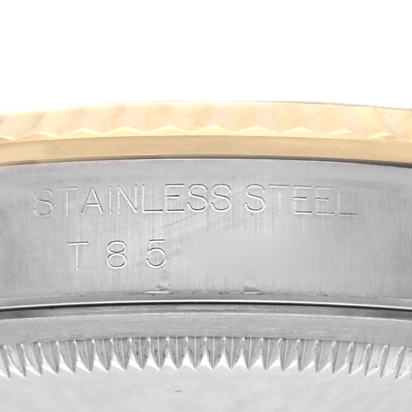 The image shows a close-up of the side engraving on the stainless steel case of a Rolex Datejust 16233 Men
s Steel and Gold (two tone) Champagne Dial 16233 Men
s Steel and Gold (two tone) Champagne Dial.