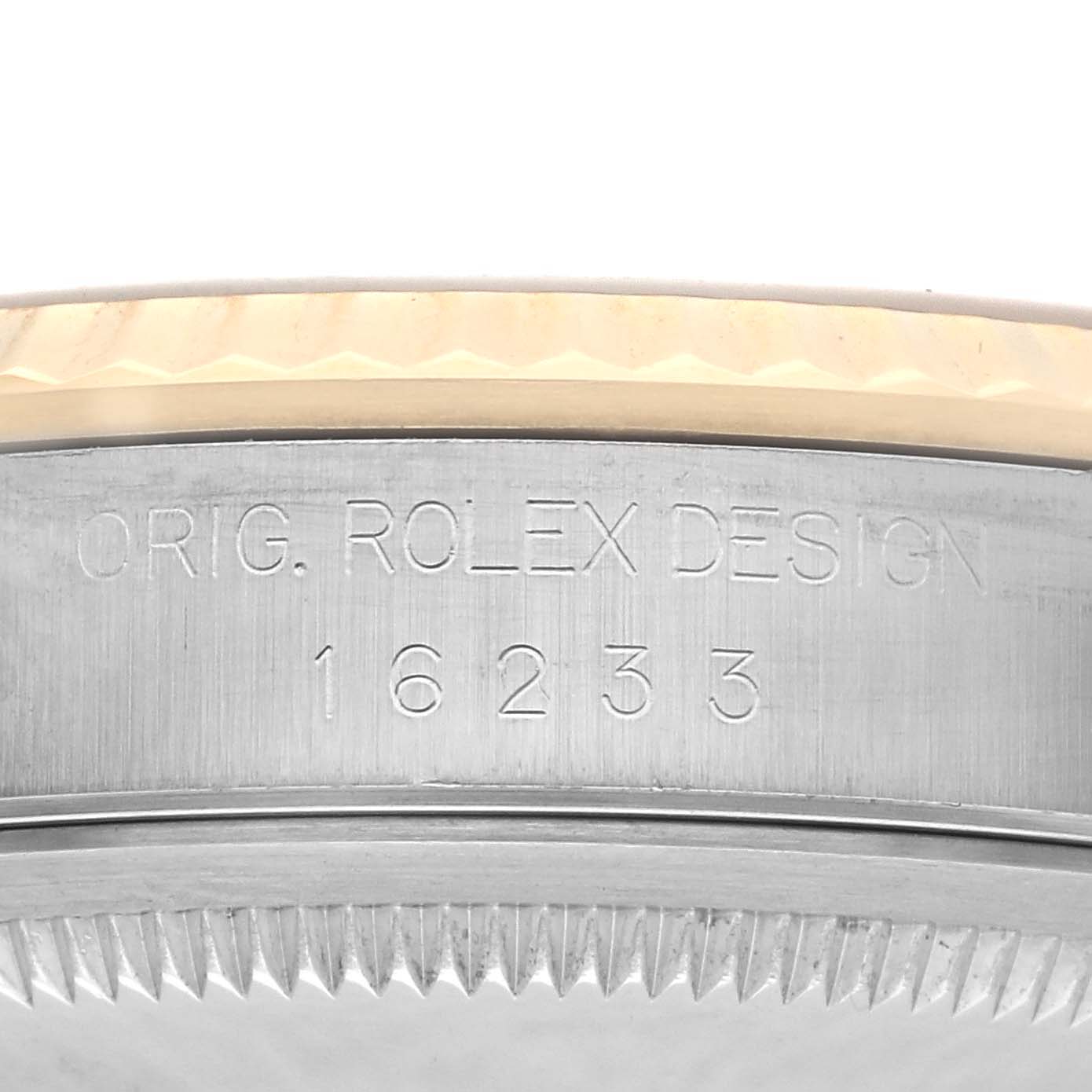 This image shows the side engraving and bezel of a Rolex Datejust 16233 Men
s Steel and Gold (two tone) Champagne Dial 16233 Men
s Steel and Gold (two tone) Champagne Dial watch, highlighting the model number 16233.