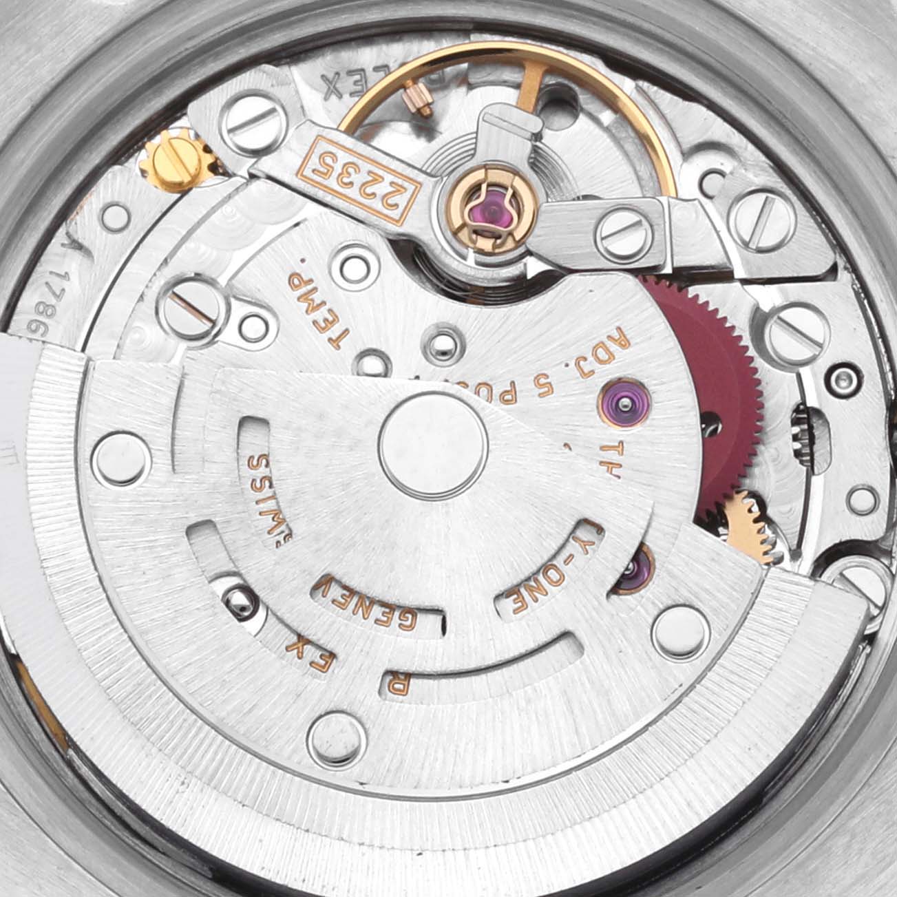 The image shows the movement of a Rolex Datejust 179173 Women's Steel and Gold (two tone) Mother of Pearl Dial 179173 Women's Steel and Gold (two tone) Mother of Pearl Dial watch, highlighting the rotor and intricate mechanical parts.