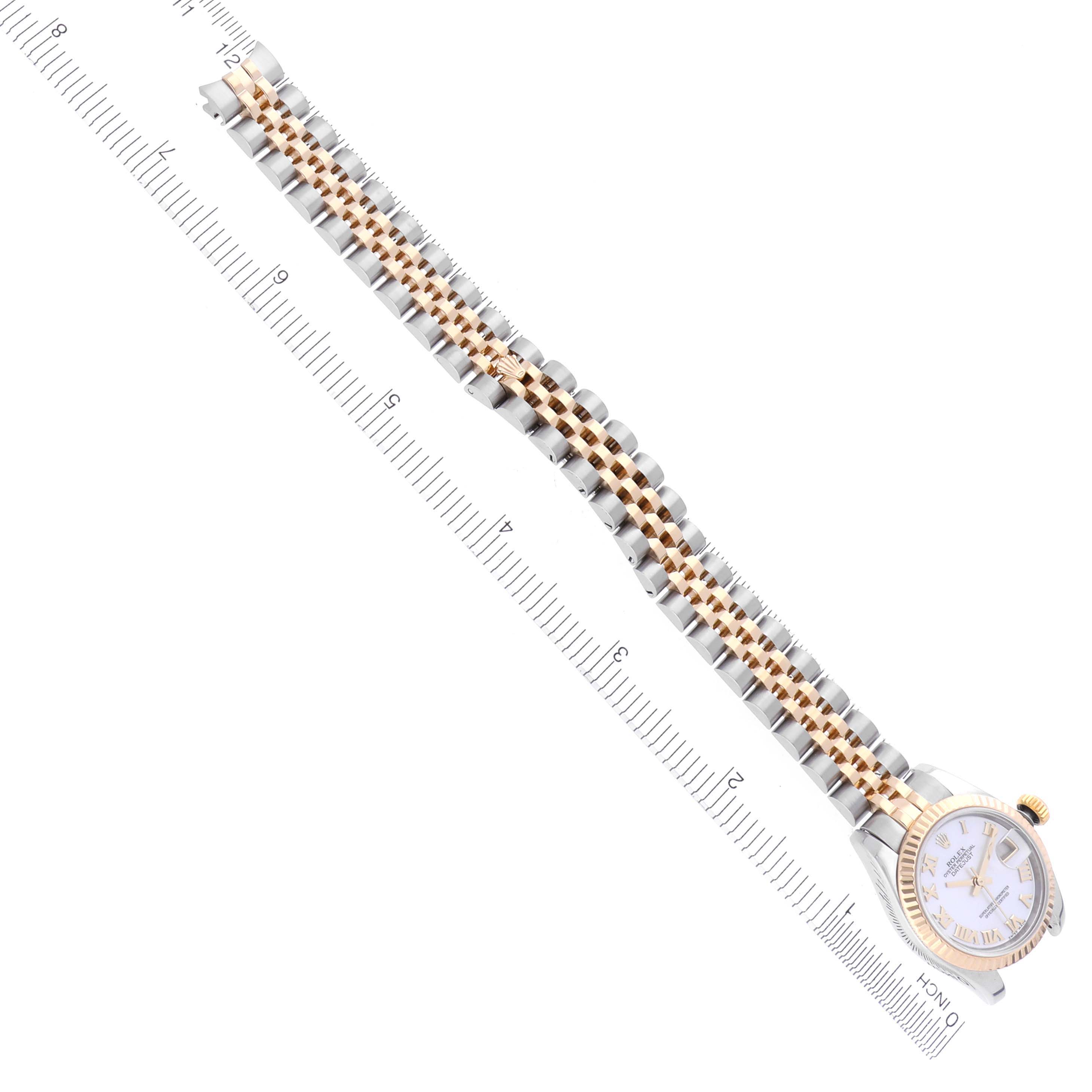 The Rolex Datejust 179173 Women's Steel and Gold (two tone) Mother of Pearl Dial 179173 Women's Steel and Gold (two tone) Mother of Pearl Dial watch is shown from a top-down angle, featuring the full length of the bracelet and partial view of the face.
