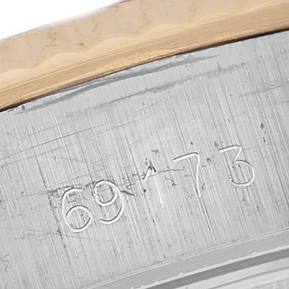 This image shows a close-up of the engraved model numbers on the side of a Rolex Datejust 69173 Women's Steel and Gold (two tone) White Dial 69173 Women's Steel and Gold (two tone) White Dial's case.
