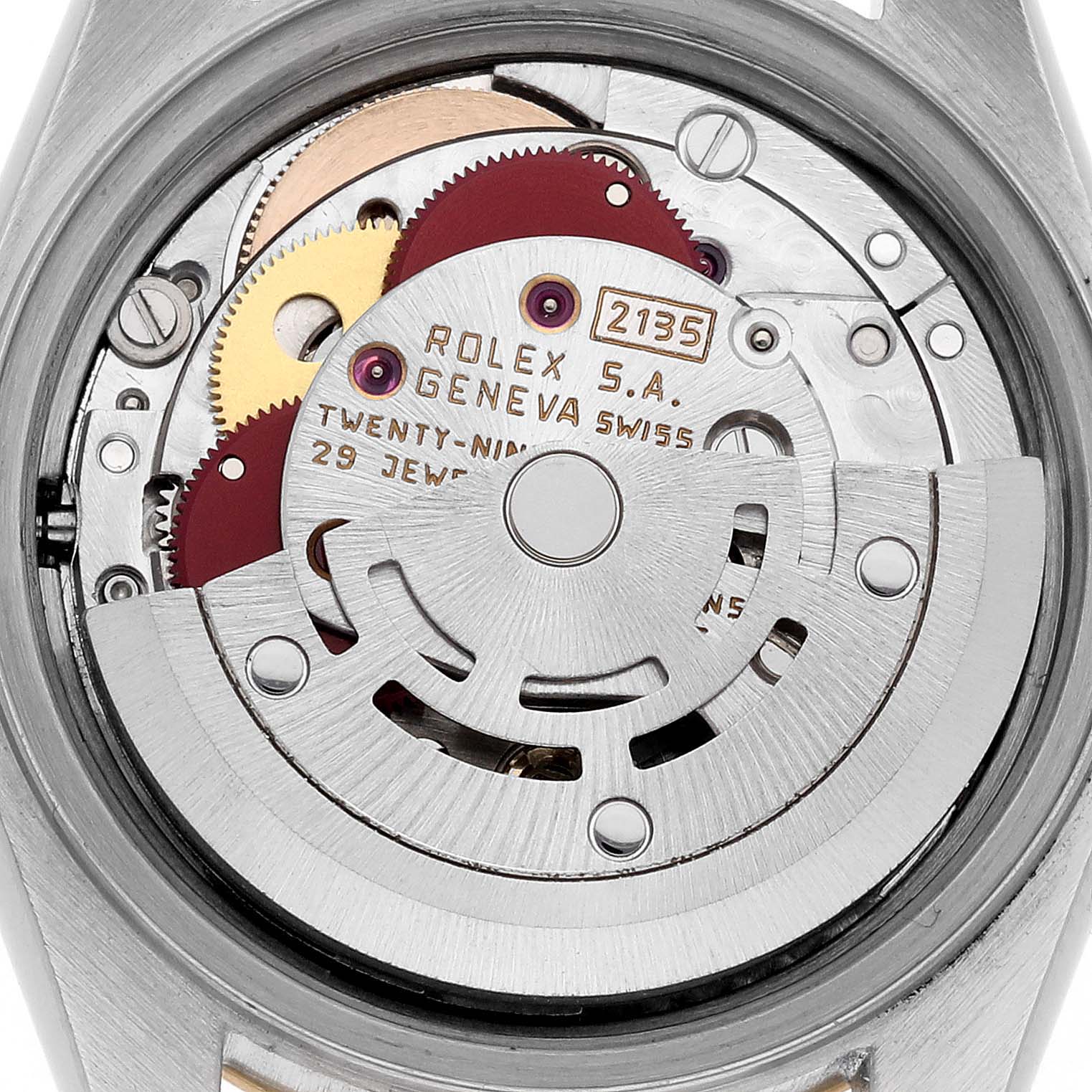 The image shows the movement parts of a Rolex Datejust 69173 Women's Steel and Gold (two tone) White Dial 69173 Women's Steel and Gold (two tone) White Dial watch from a top-down angle, revealing gears and inscriptions.